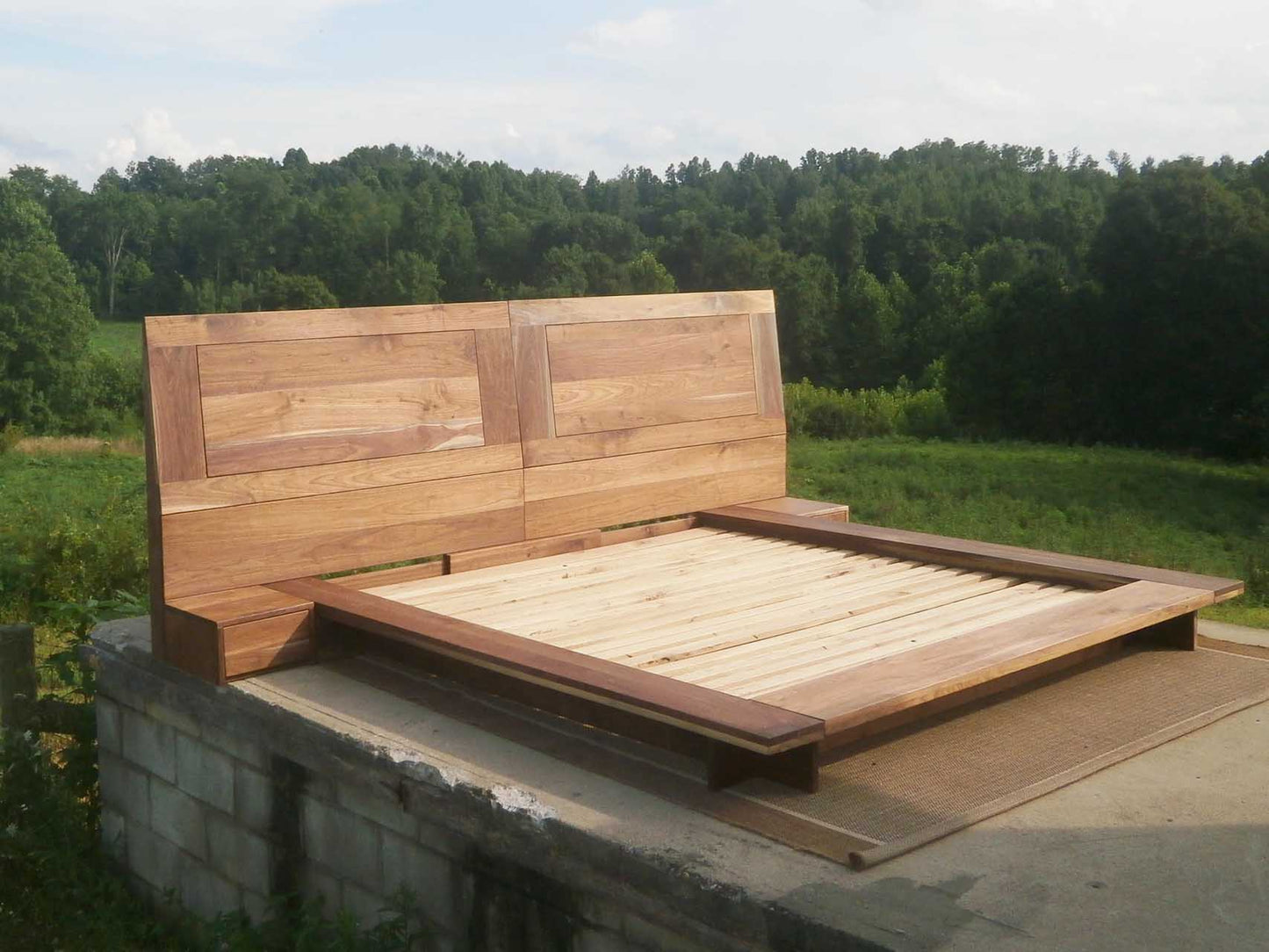 platform bed with side tables angled side view