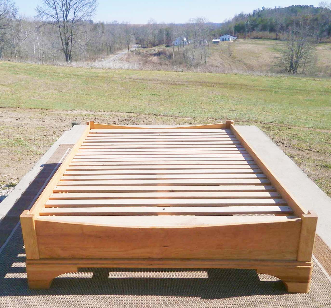 Platform Bed with large block feet and arched ends front top view