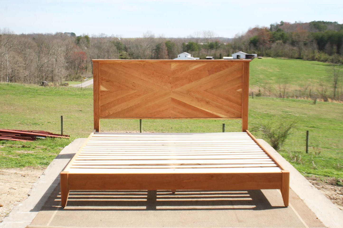 Platform Bed with headboard in herringbone style light colored front view