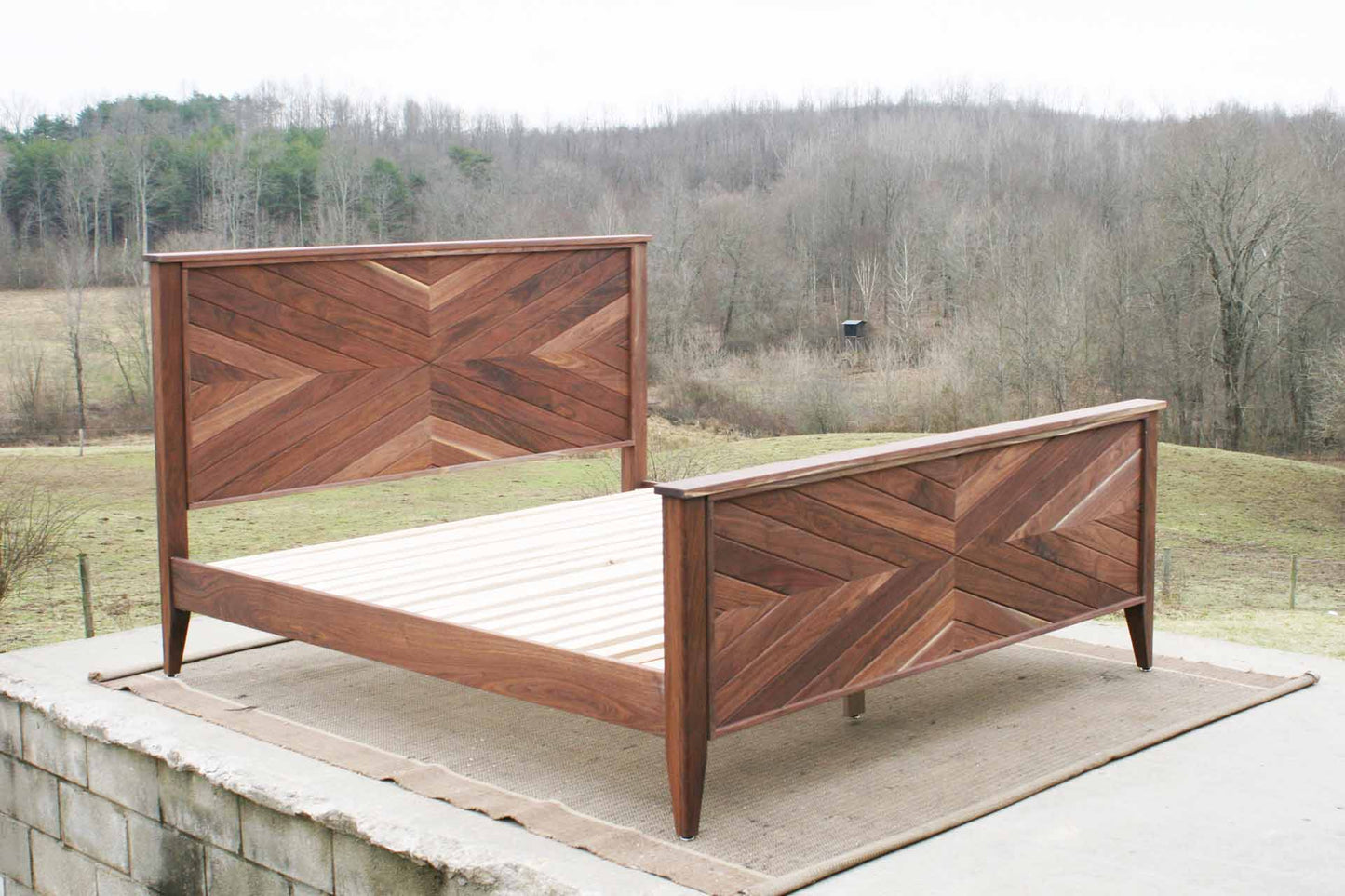 Platform Bed with headboard in herringbone style with foot board side view