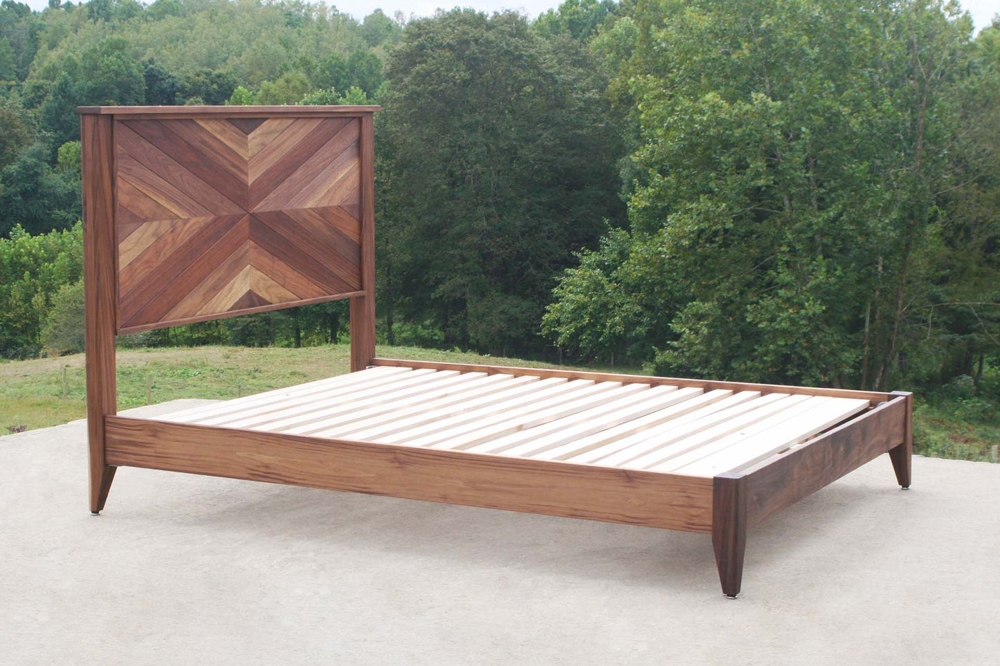 side angled view natural Platform Bed with headboard in herringbone style