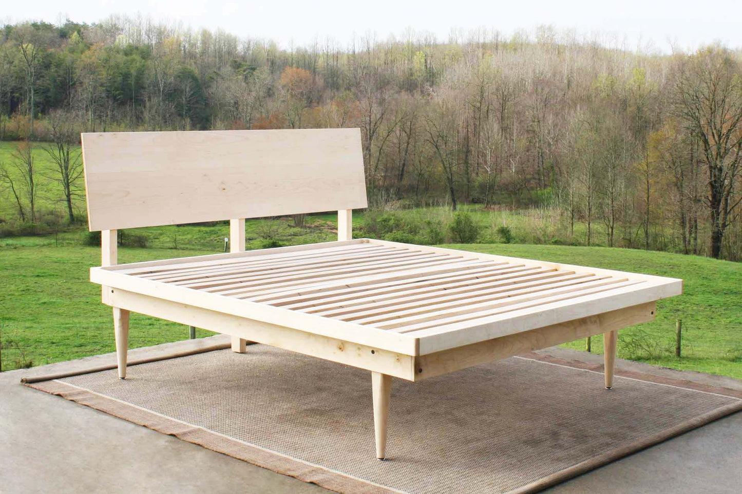 mid century platform bed angled view