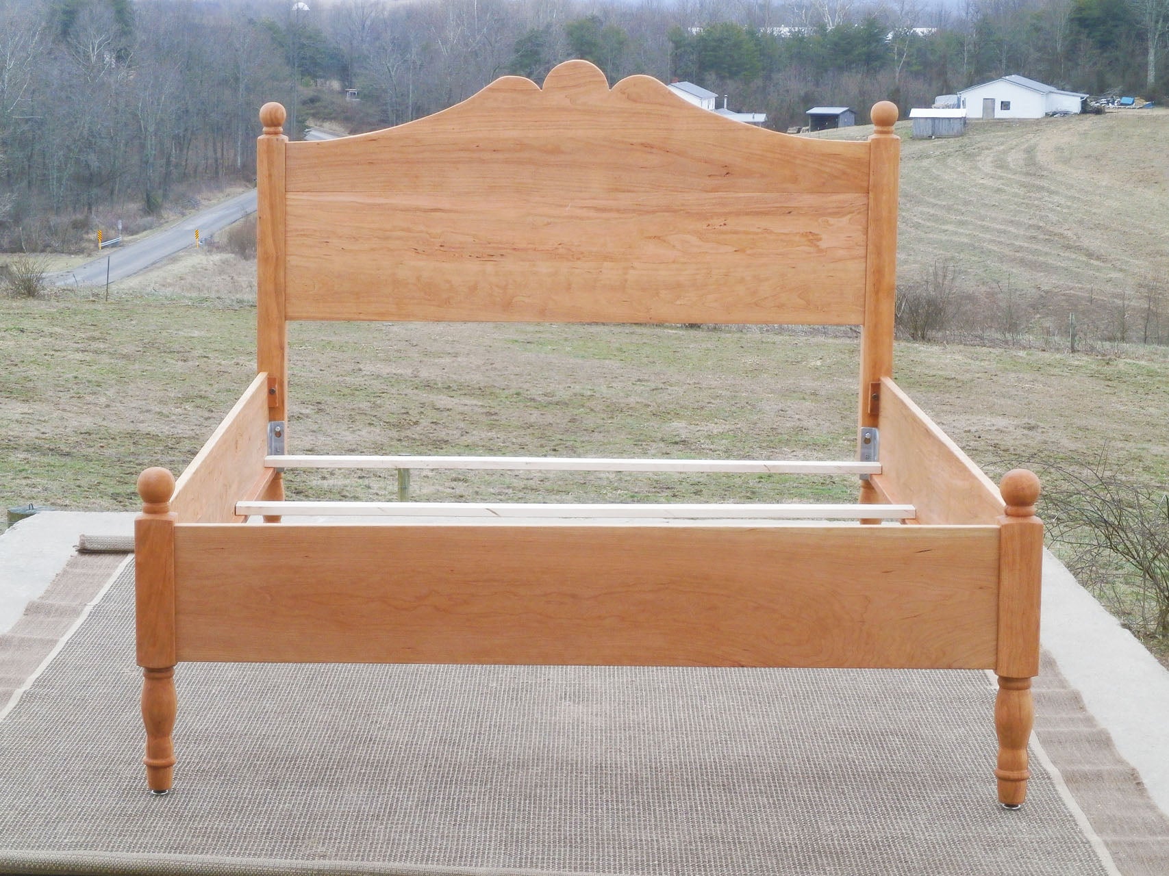 front view Classic four poster bed with turned posts and scrolled headboard