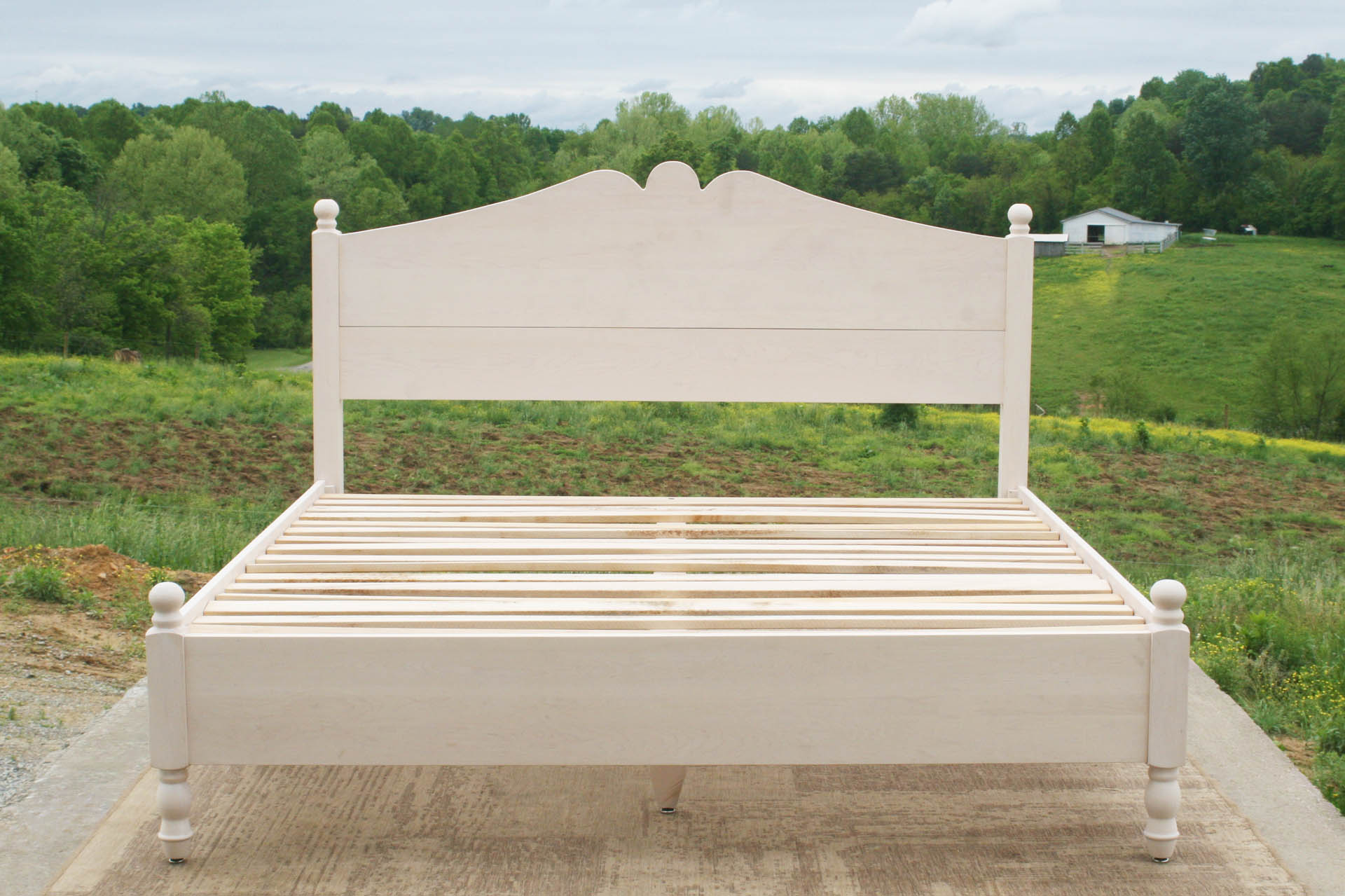 front view Classic four poster bed with turned posts and scrolled headboard