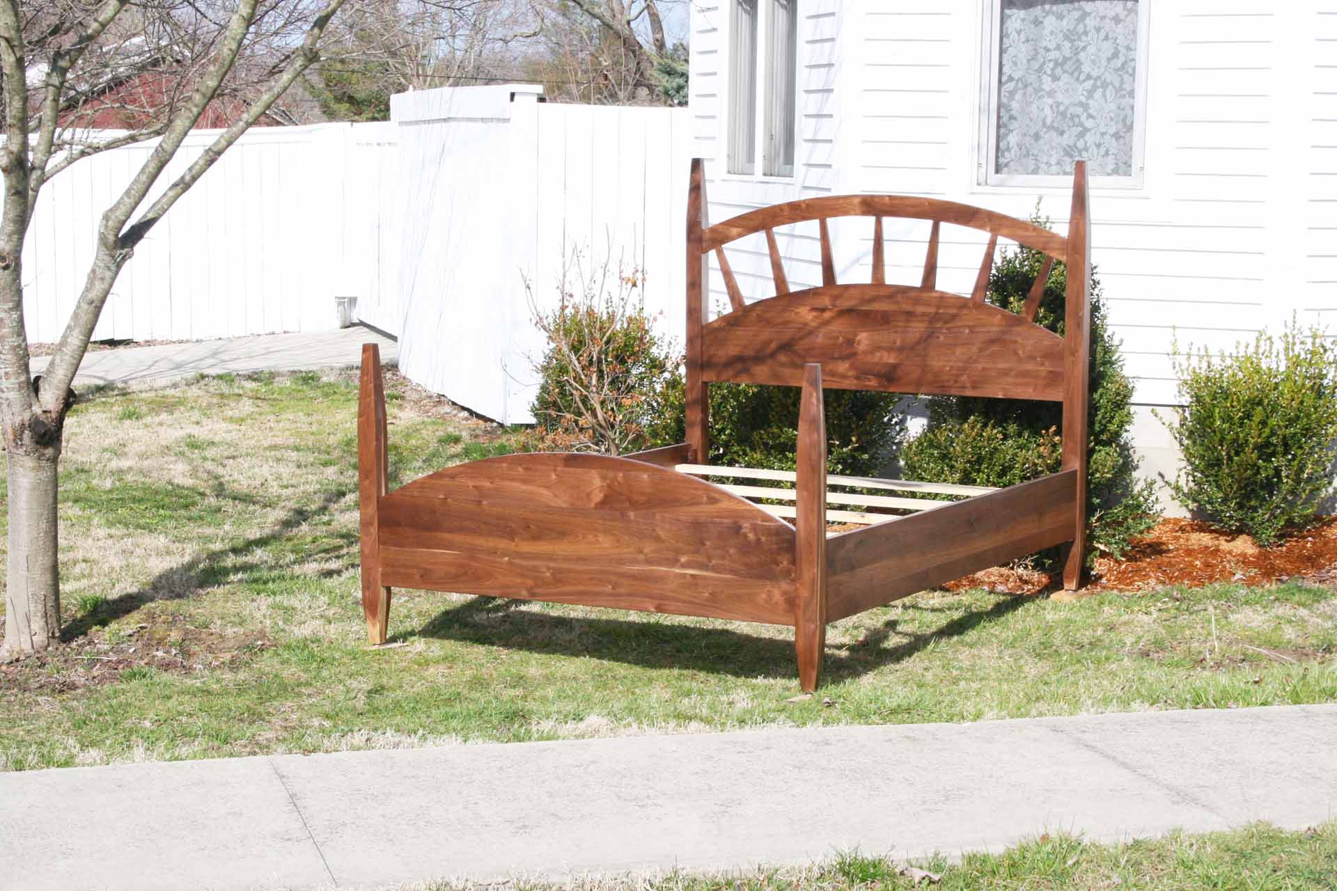 angled view sun ray bed with arched headboard zoomed alternate view