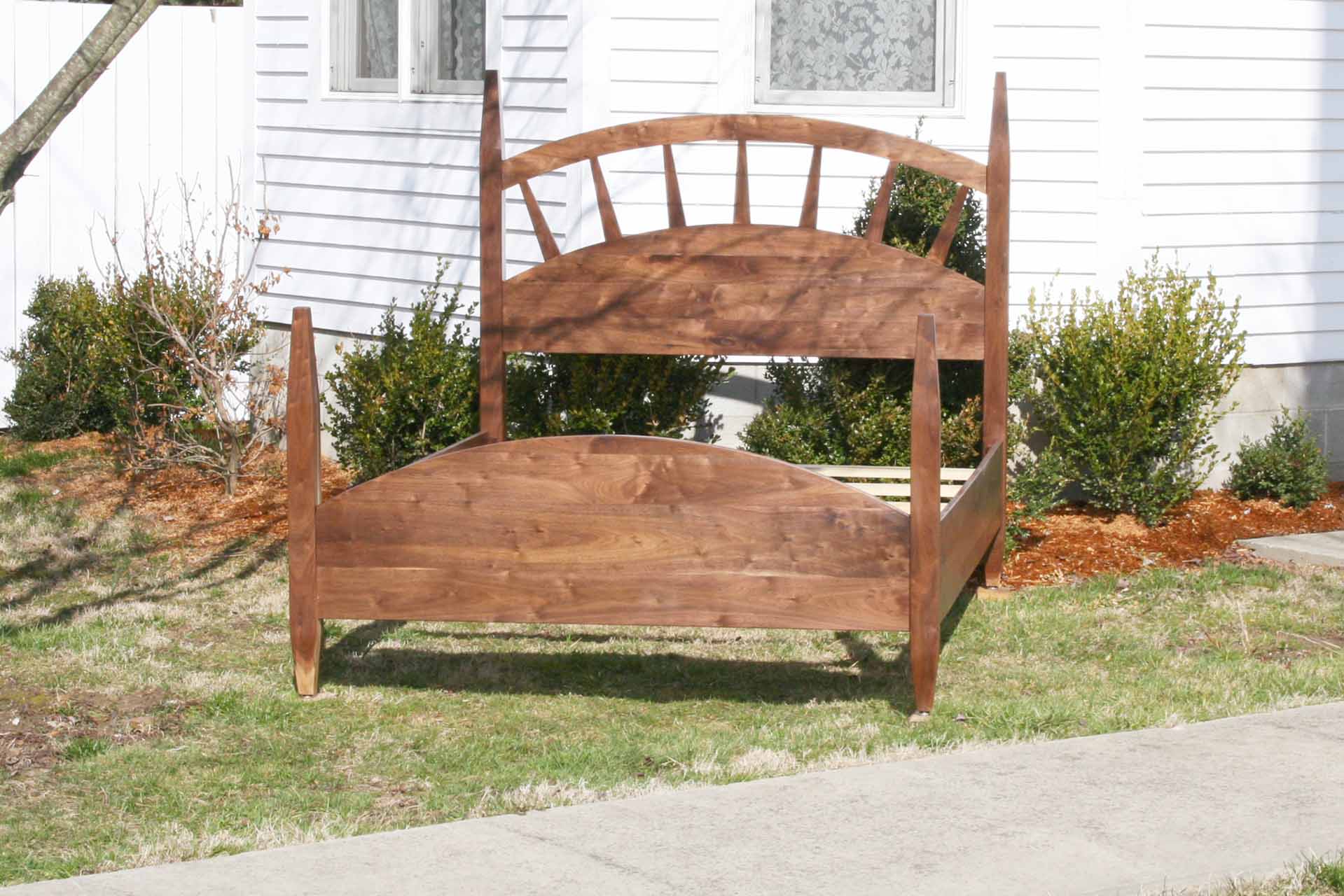 sun ray bed with arched headboard front angled view