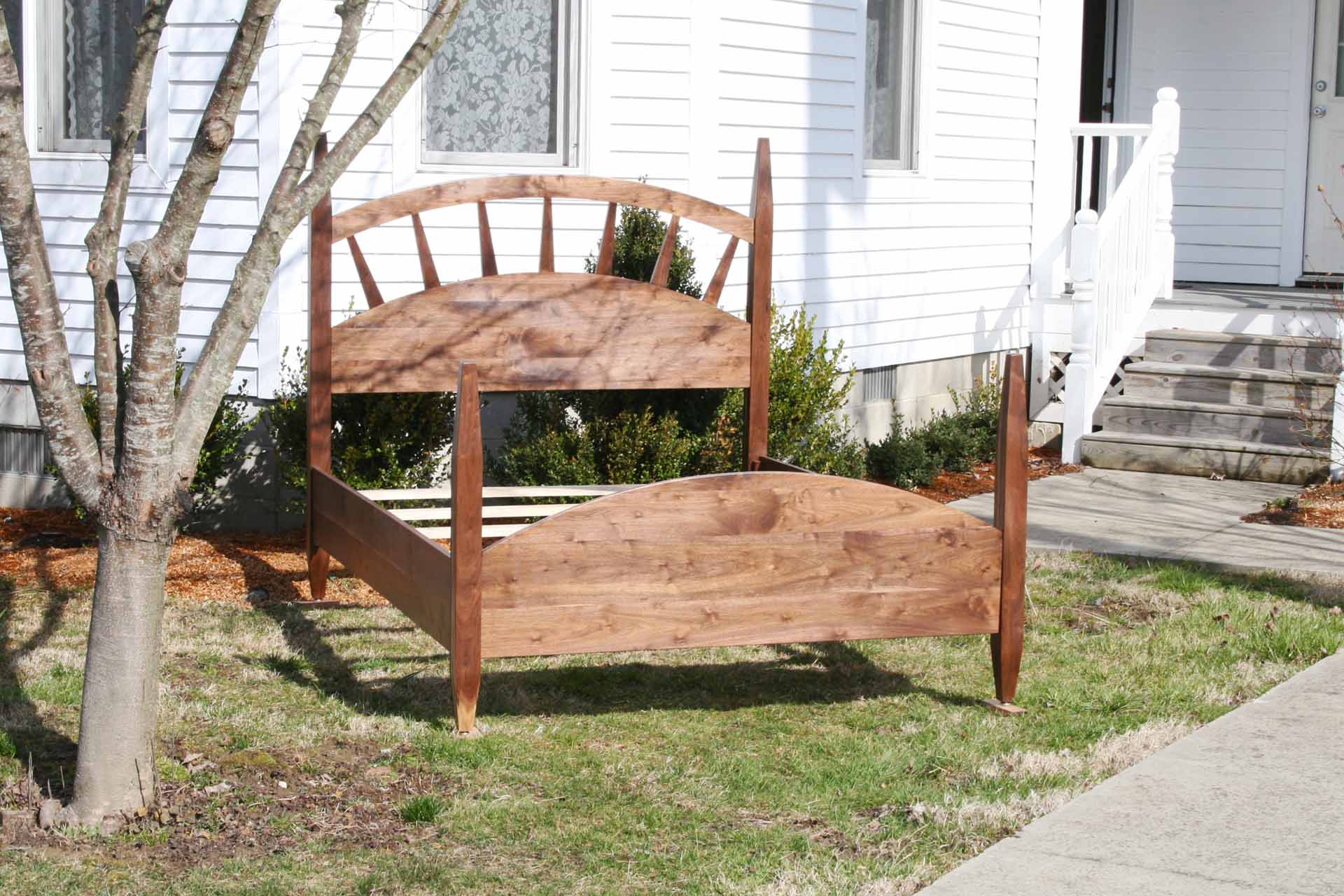 sun ray bed with arched headboard natural