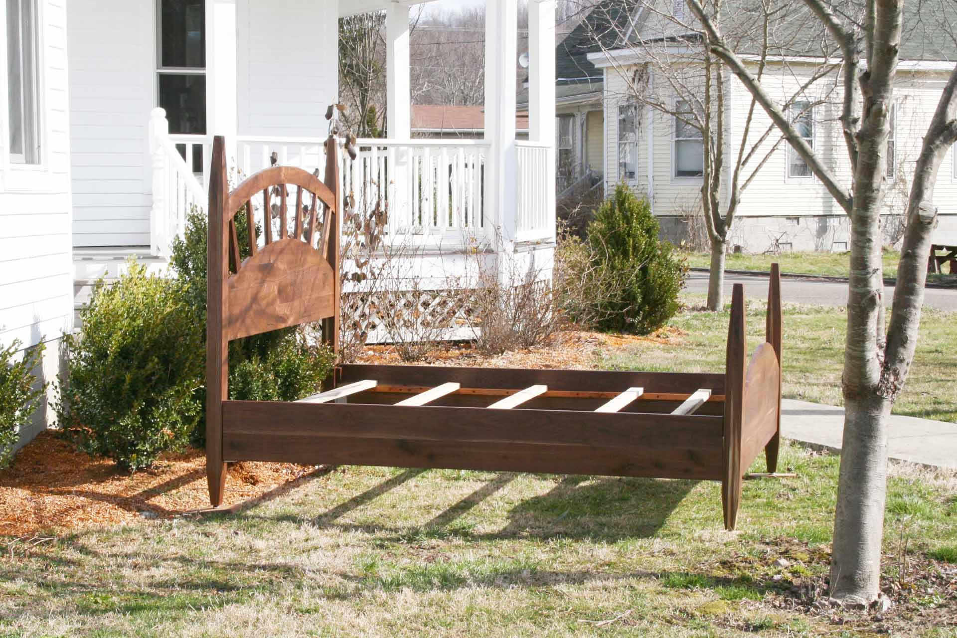 sun ray bed with arched headboard side close up view