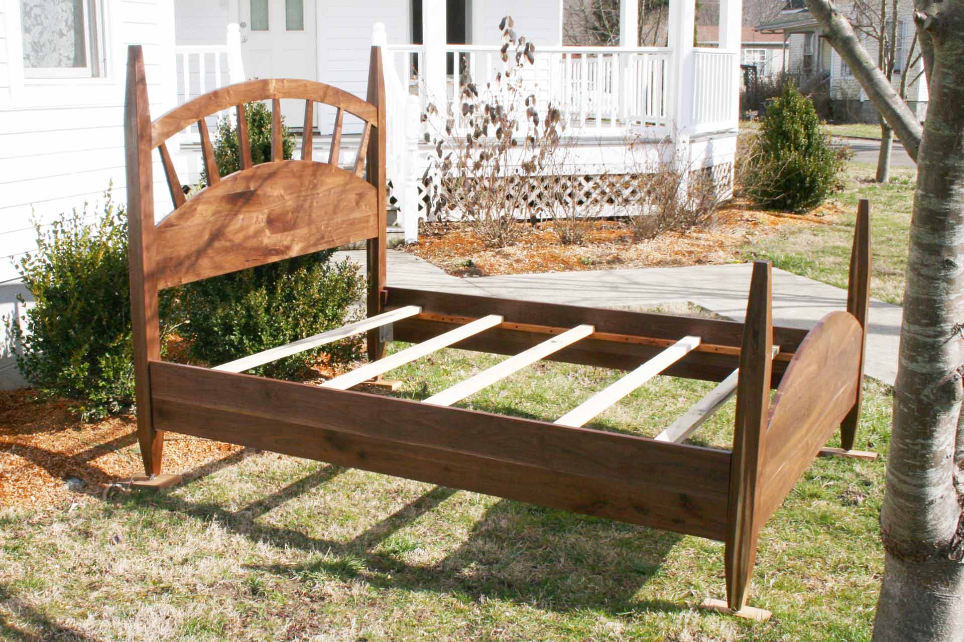 sun ray bed with arched headboard zoomed in side view