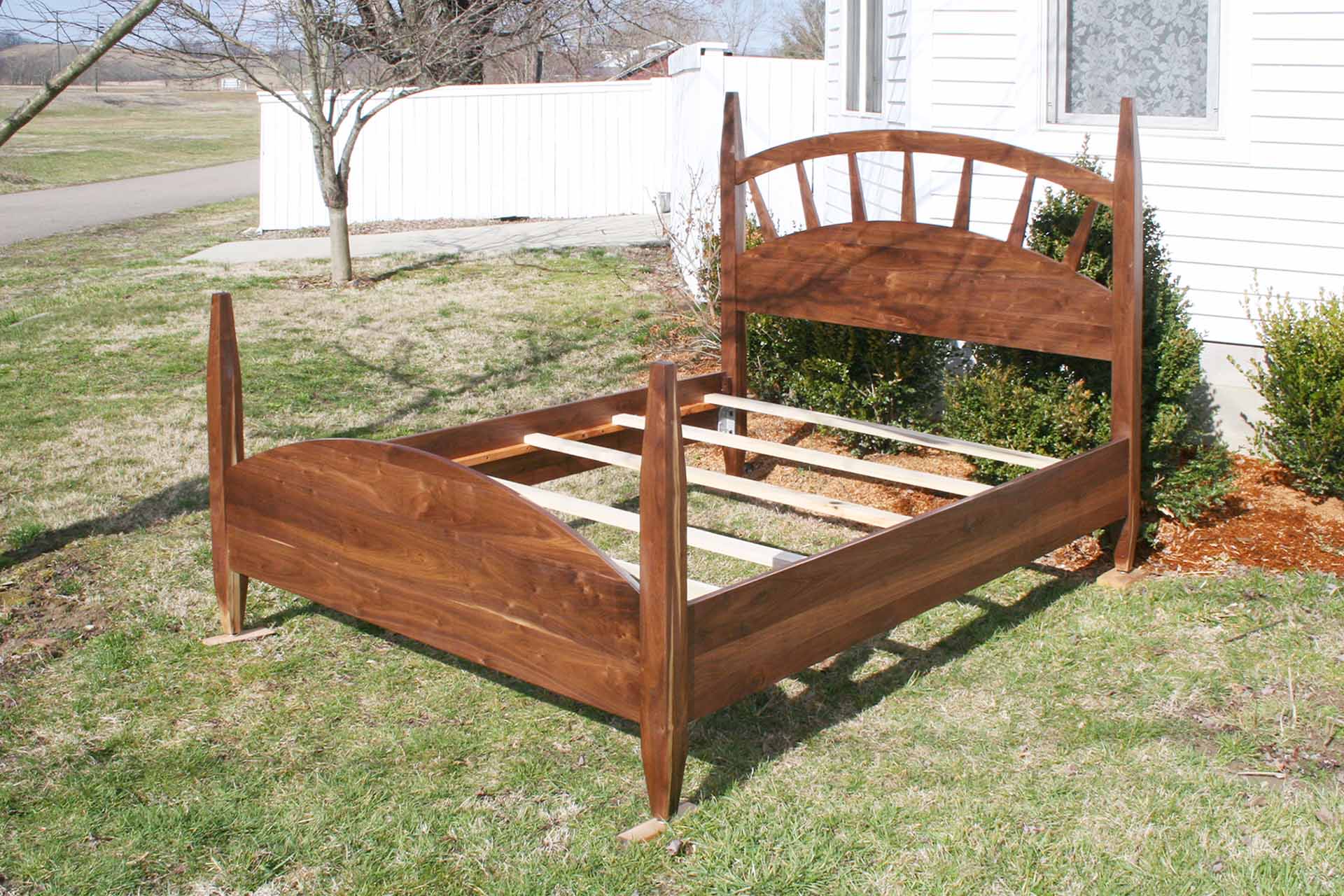 sun ray bed with arched headboard