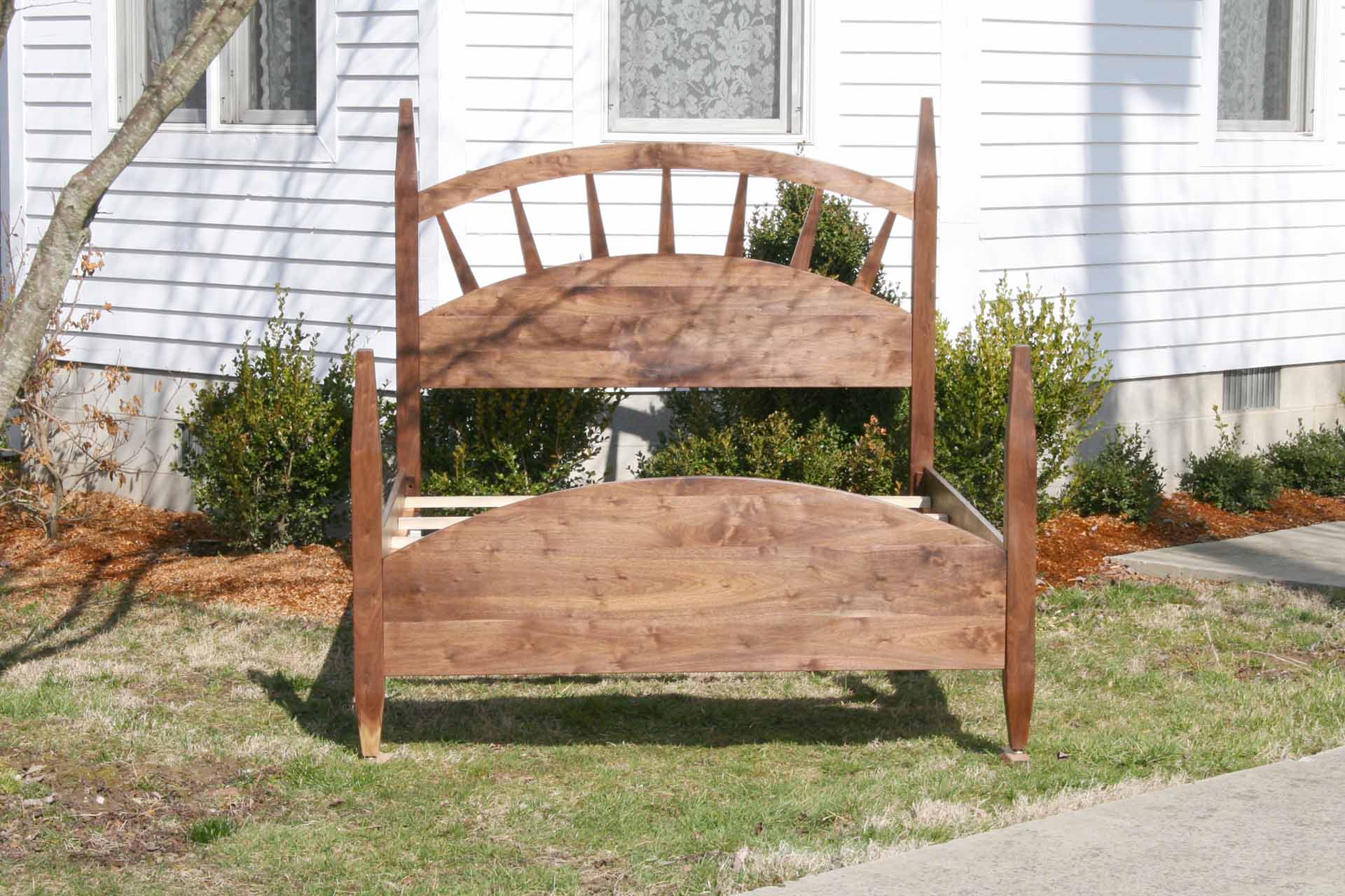 sun ray bed with arched headboard straight front view