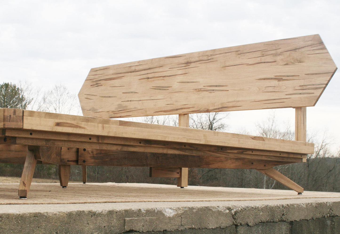 low angled view wormy maple Mid century platform bed