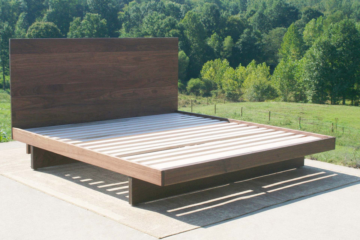cantilever platform bed with headboard in walnut wood