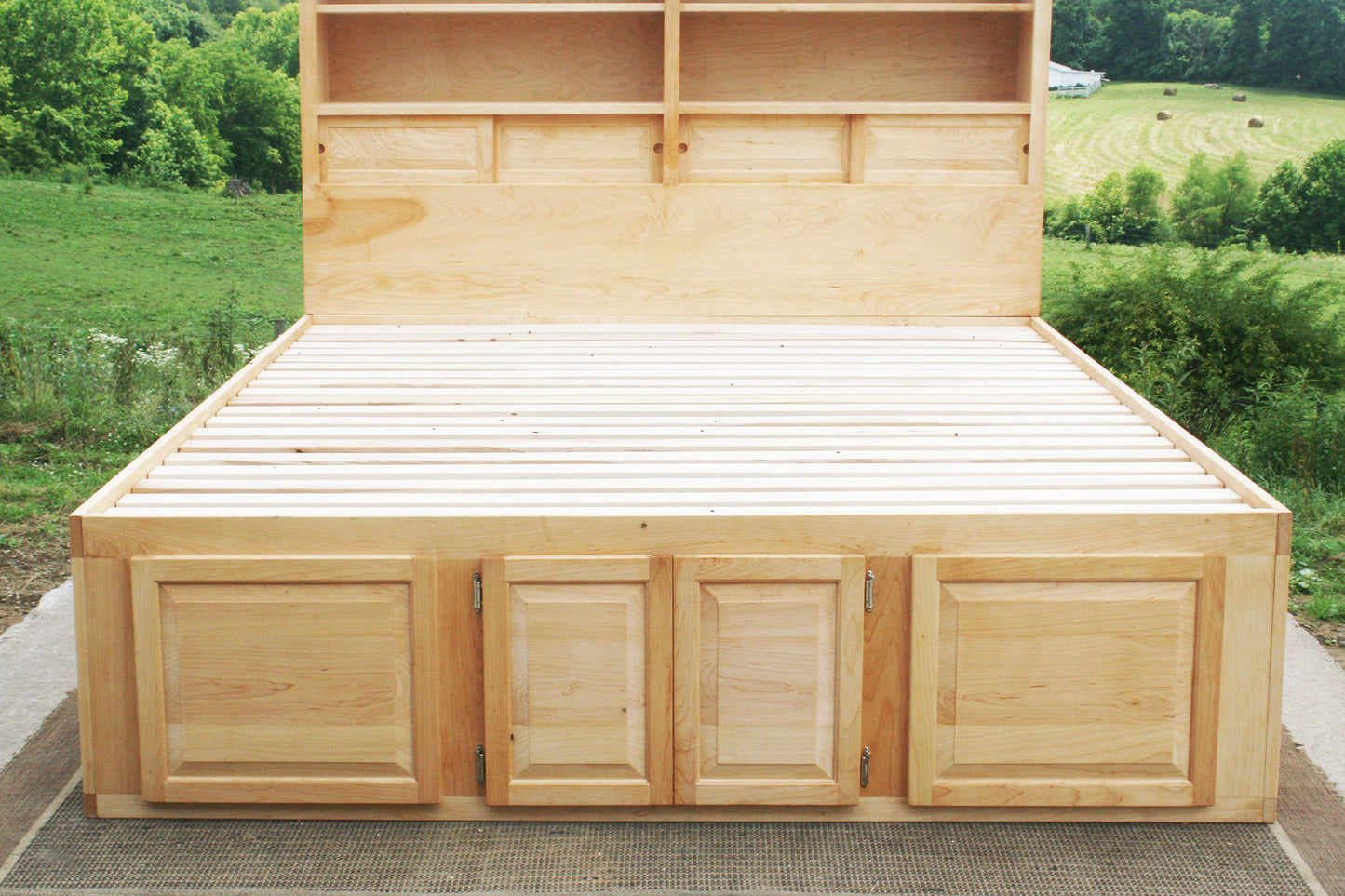 end area of 12 drawer captain's bed with storage headboard