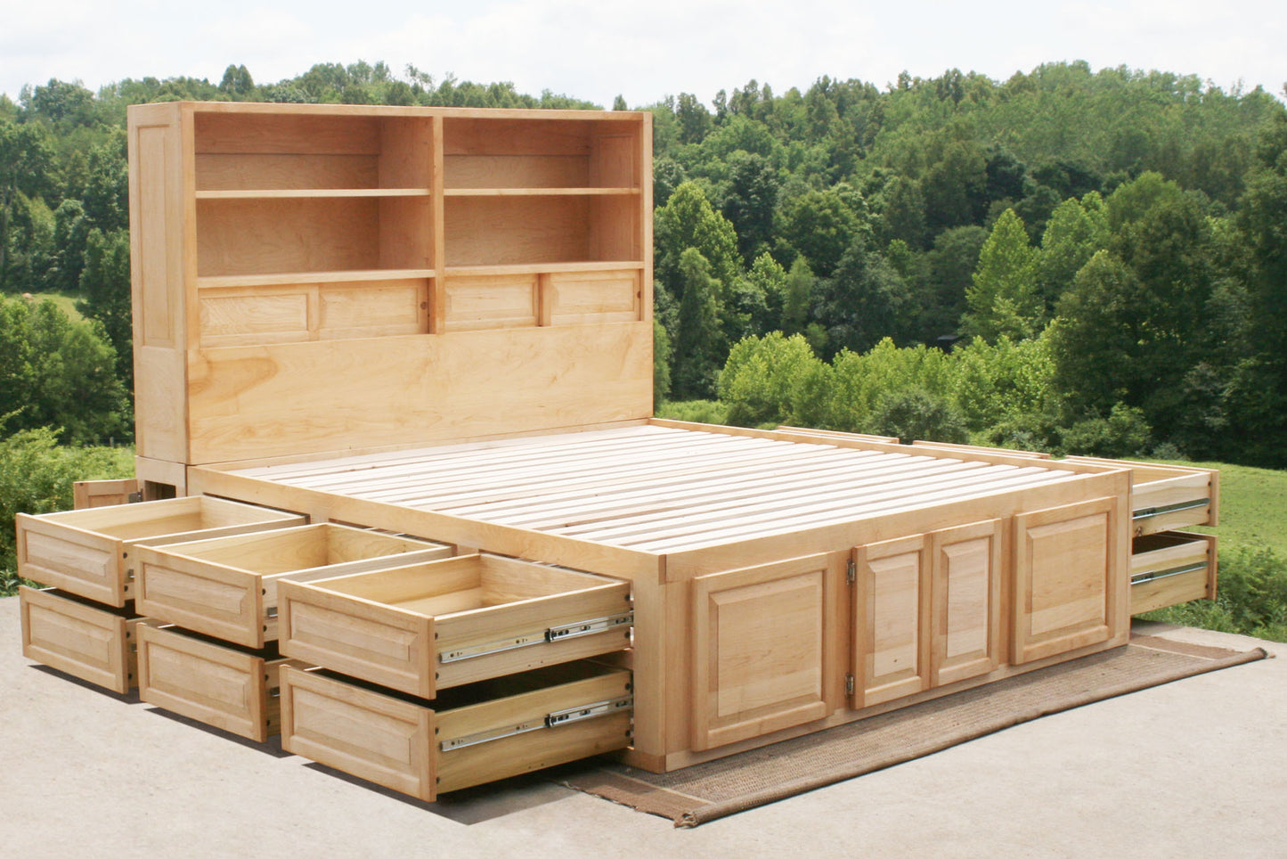angled view 12 drawer captain's bed with storage headboard and drawers out
