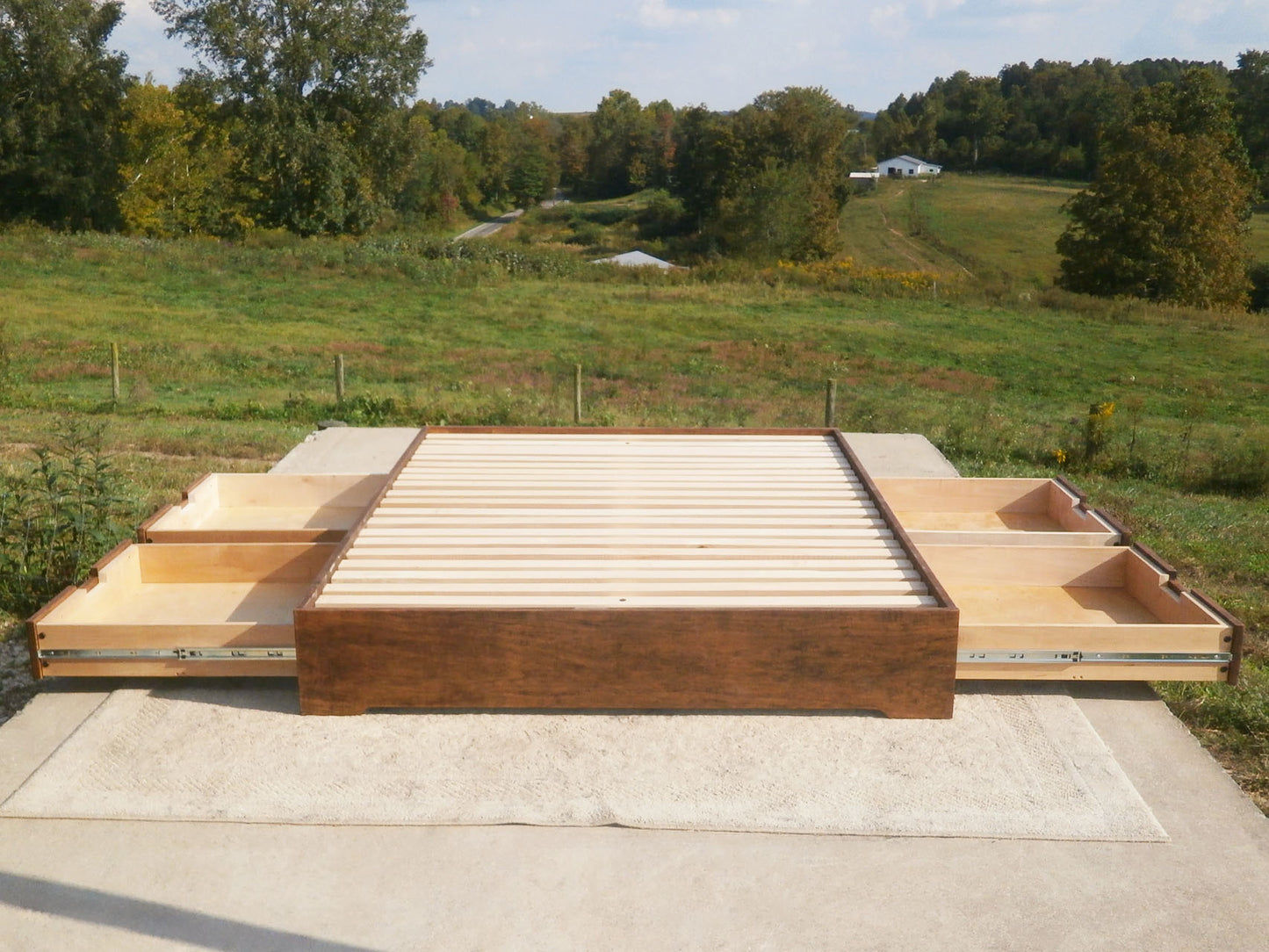 front view solid Low profile storage bed with 4 drawers open