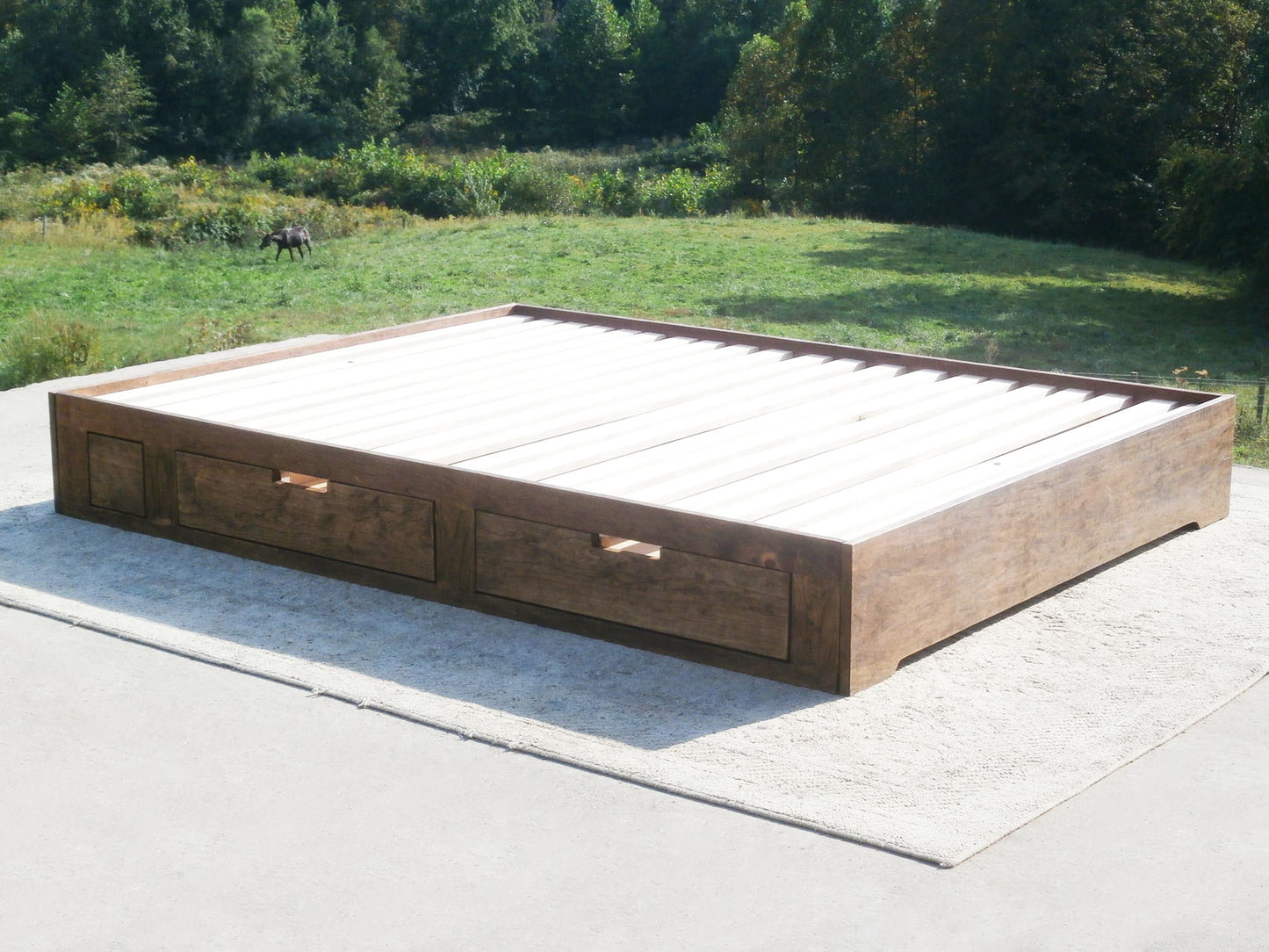 angled view natural Low profile storage bed with 4 drawers