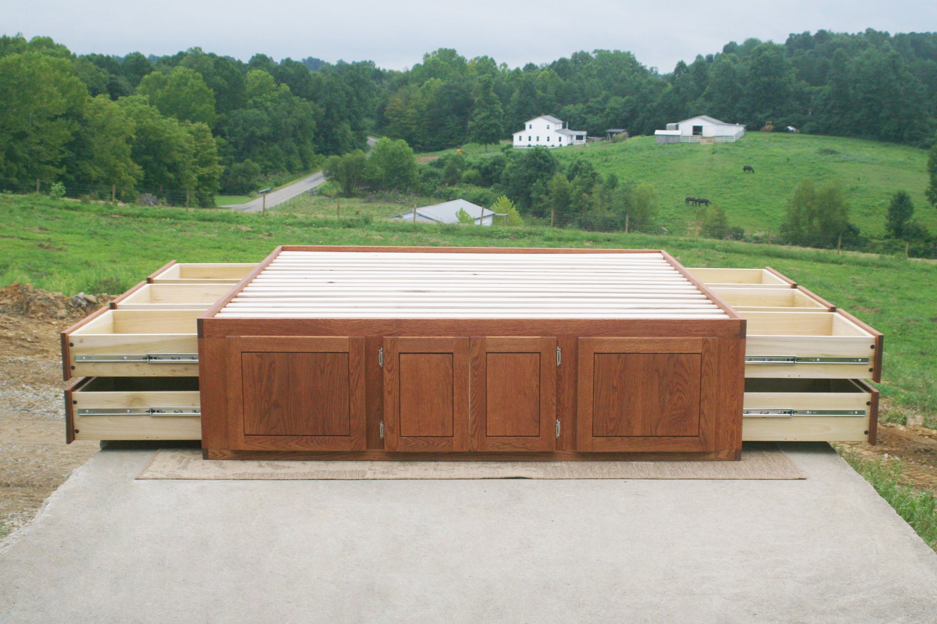 front view side drawers open Platform bed with 12 drawers and center storage area