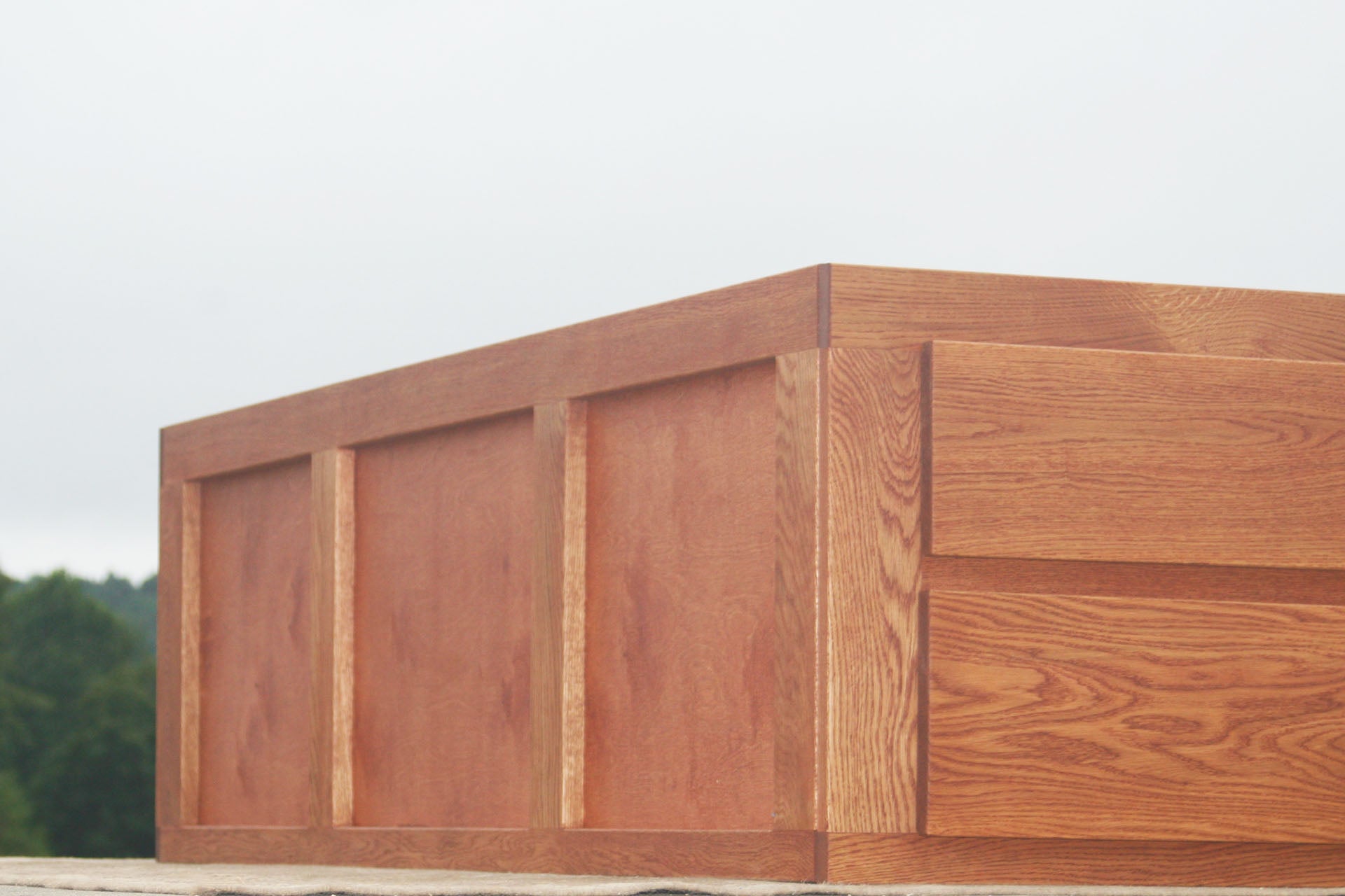 low angled view Platform bed with 12 drawers and center storage area