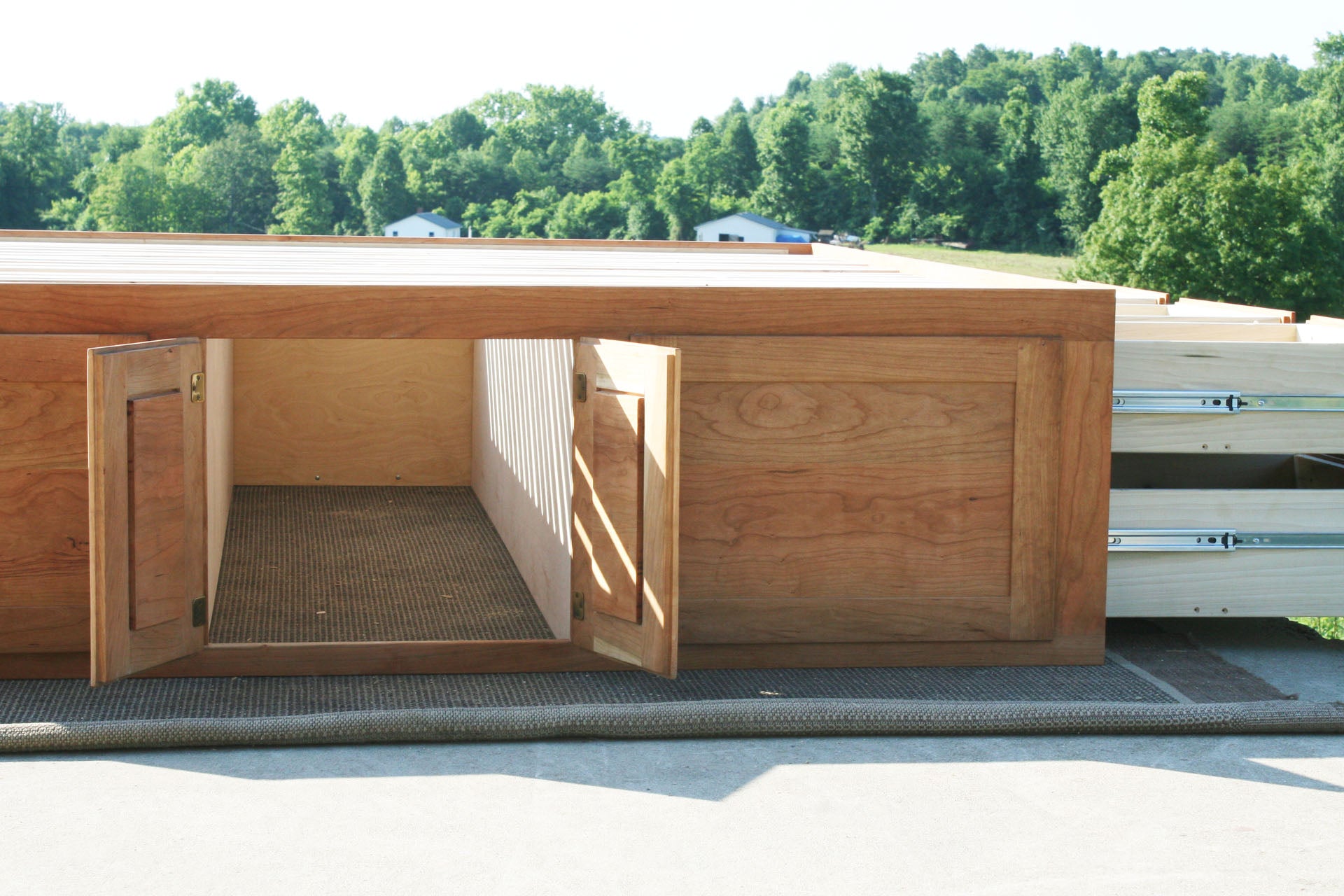 drawers open Platform bed with 12 drawers and center storage area low view
