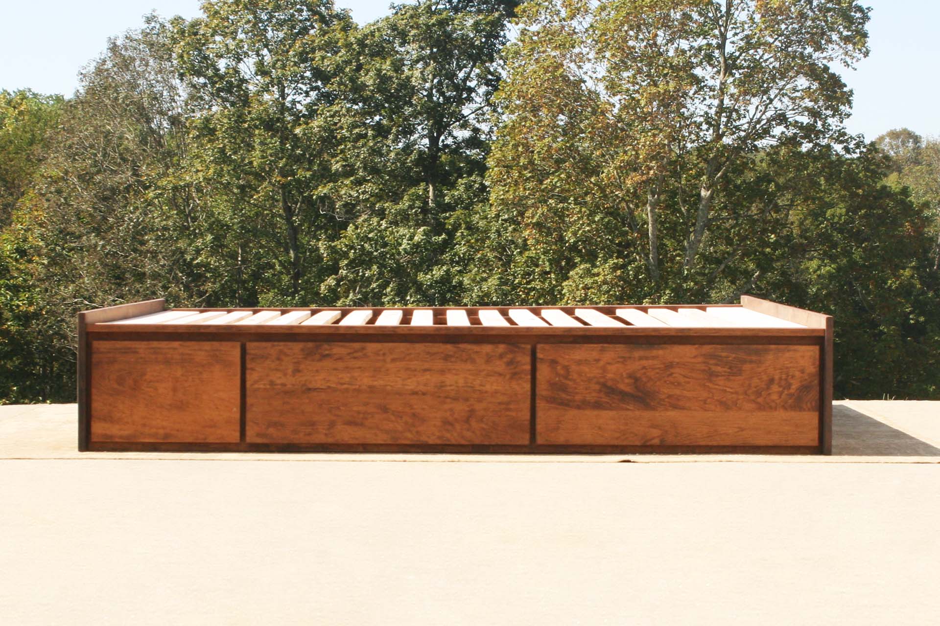 side view natural platform bed with drawers