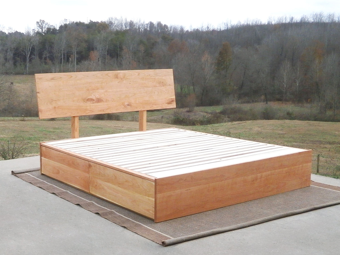 front angled view Low Storage Bed with 4 drawers and angled headboard