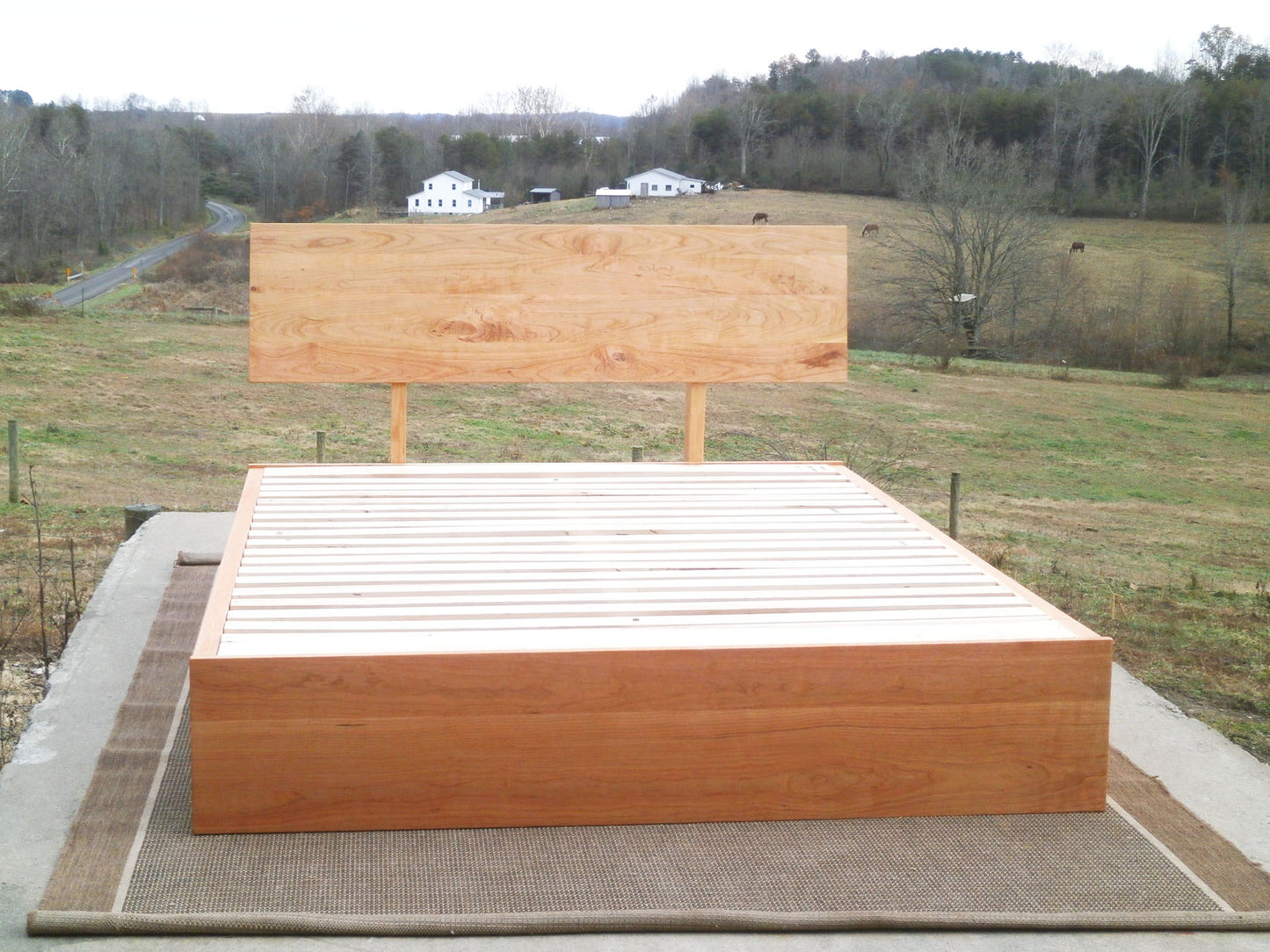 Low Storage Bed with 4 drawers and angled headboard natural wood