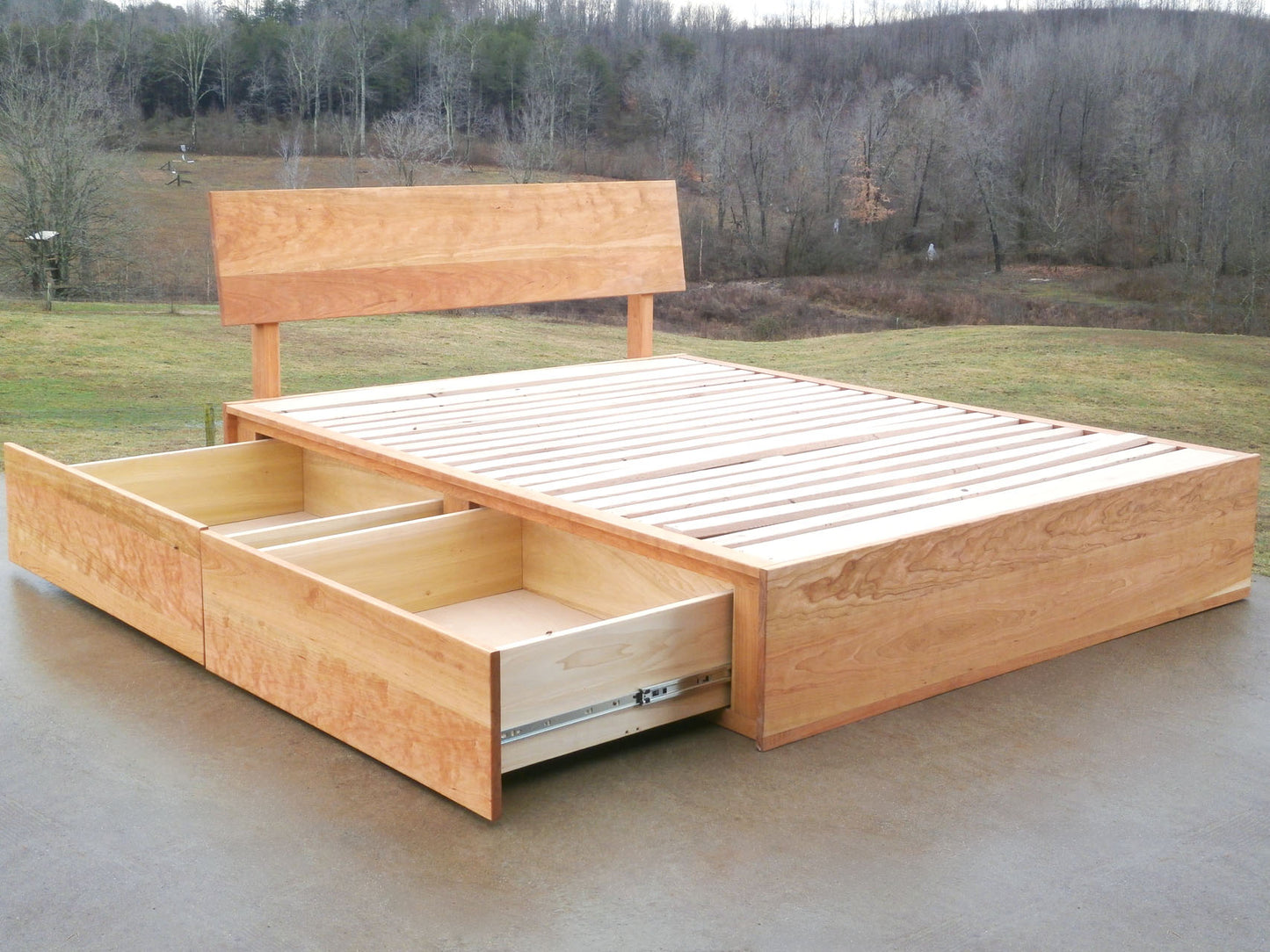 Low Storage Bed with 4 drawers out and angled headboard