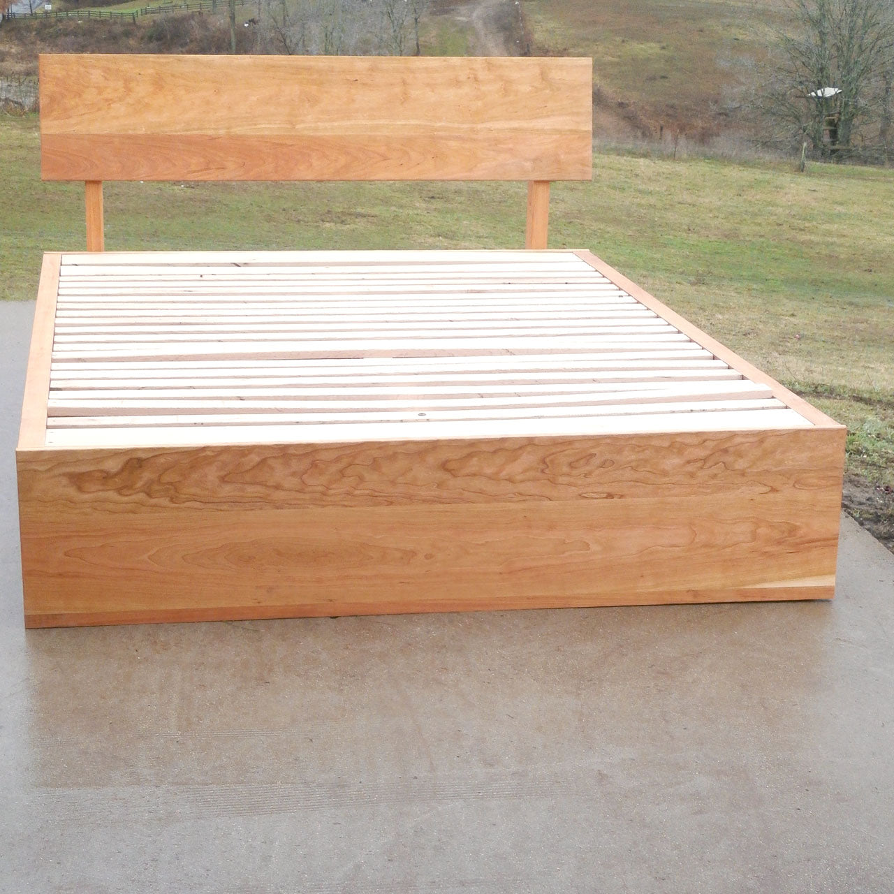 front view natural hardwood Low Storage Bed with 4 drawers and angled headboard