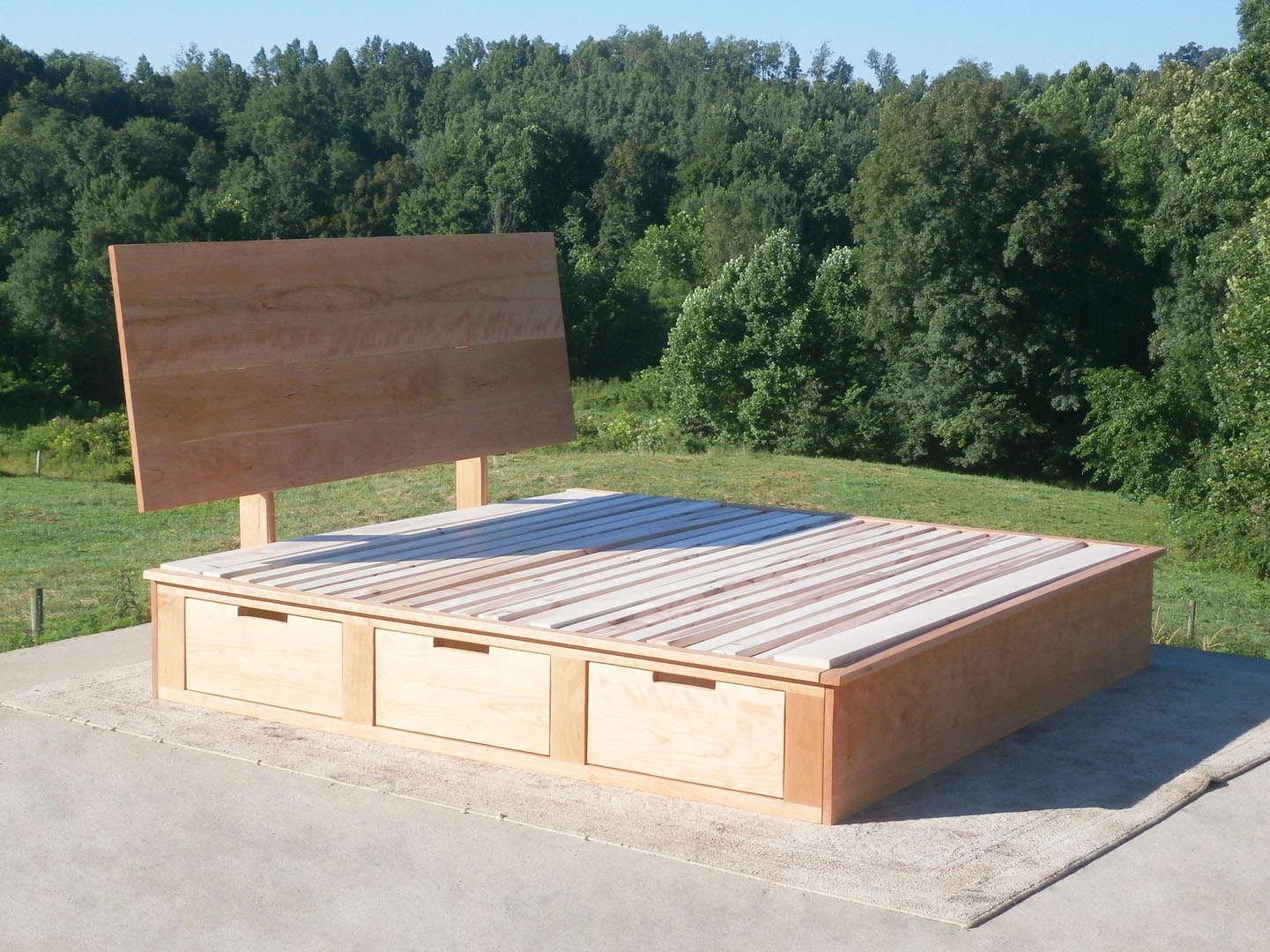 angled view wood Storage Bed with 6 drawers and angled headboard