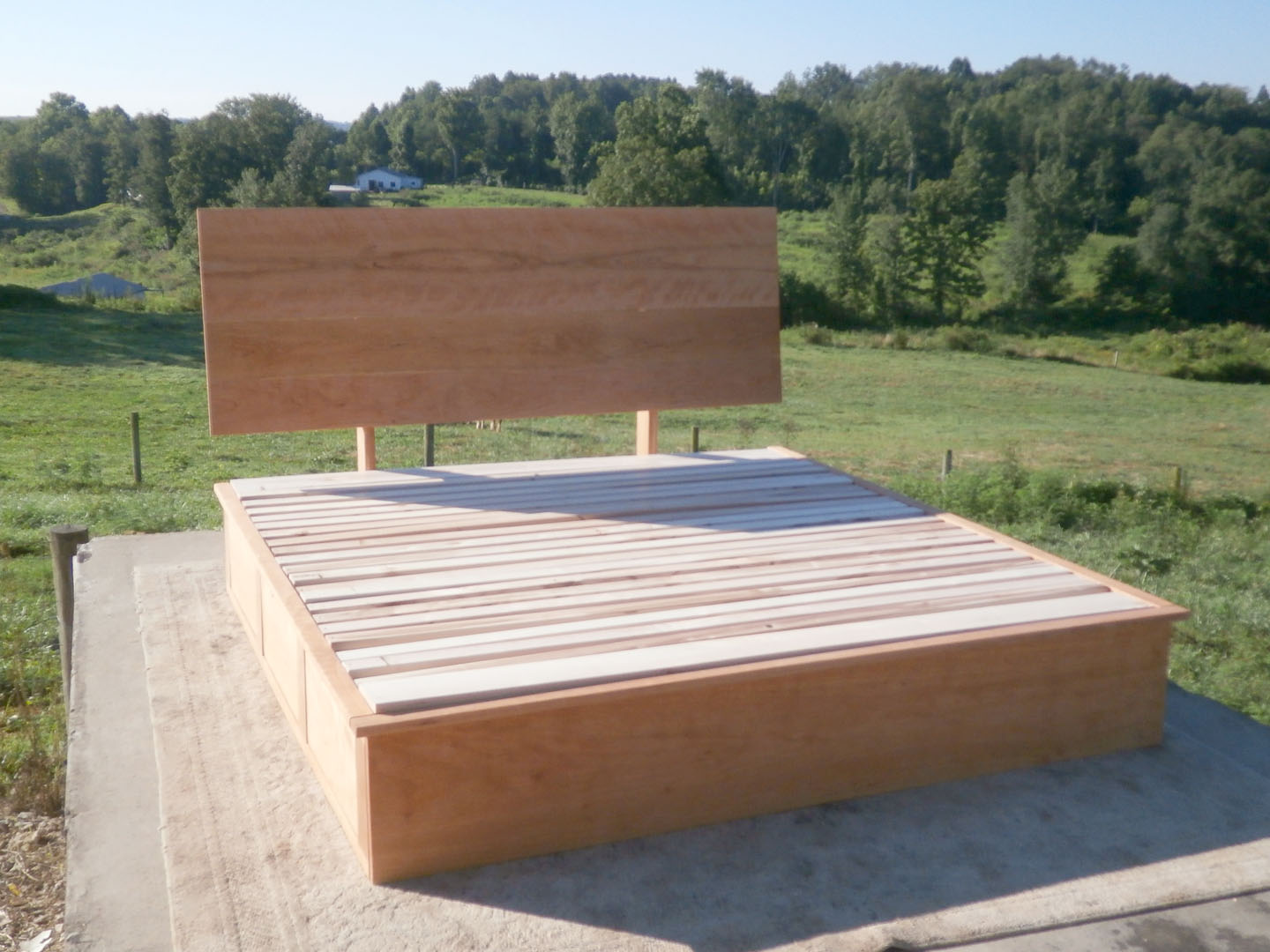 front angled view wood Storage Bed with 6 drawers and angled headboard