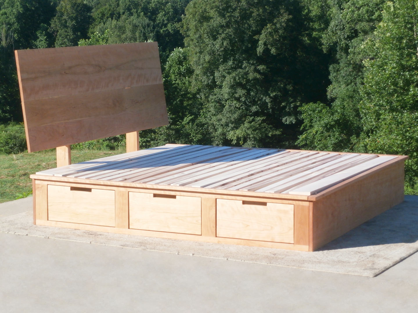 side view wood Storage Bed with 6 drawers and angled headboard