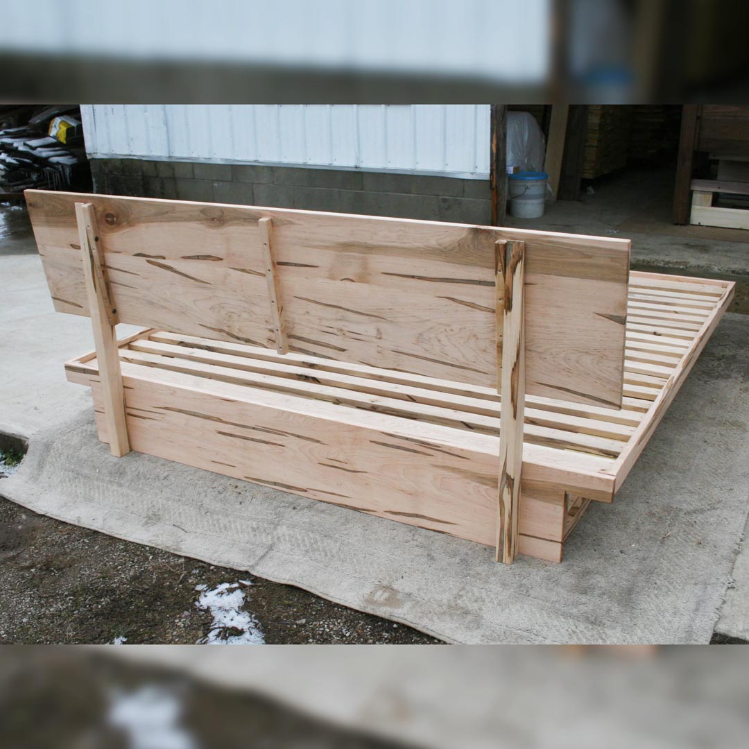 back of headboard of low platform bed with 6 drawers
