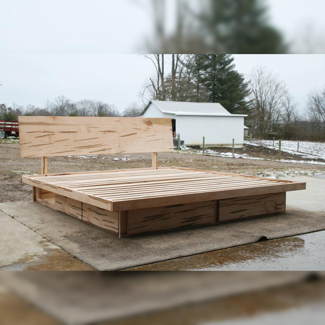 low platform bed with 6 drawers front angled view