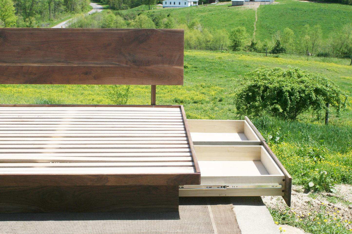 left side of drawers out close up Low platform storage bed with 4 drawers
