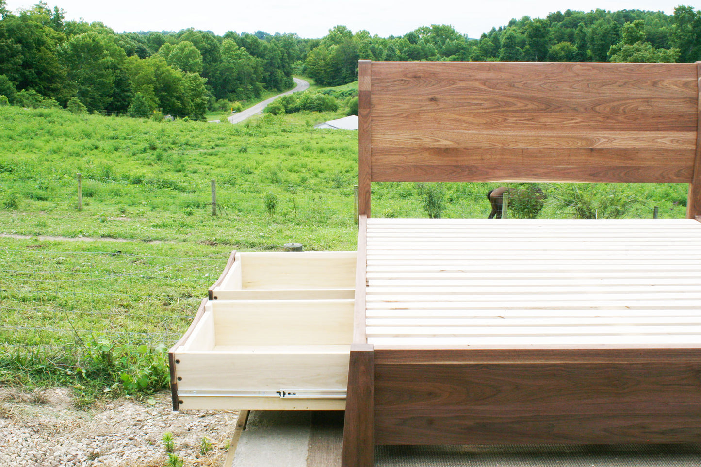side of Sleigh Platform bed with 4 drawers and large posts 2 drawer open