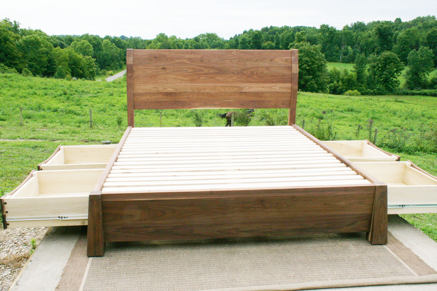 front view Sleigh Platform bed with 4 drawers open and large posts