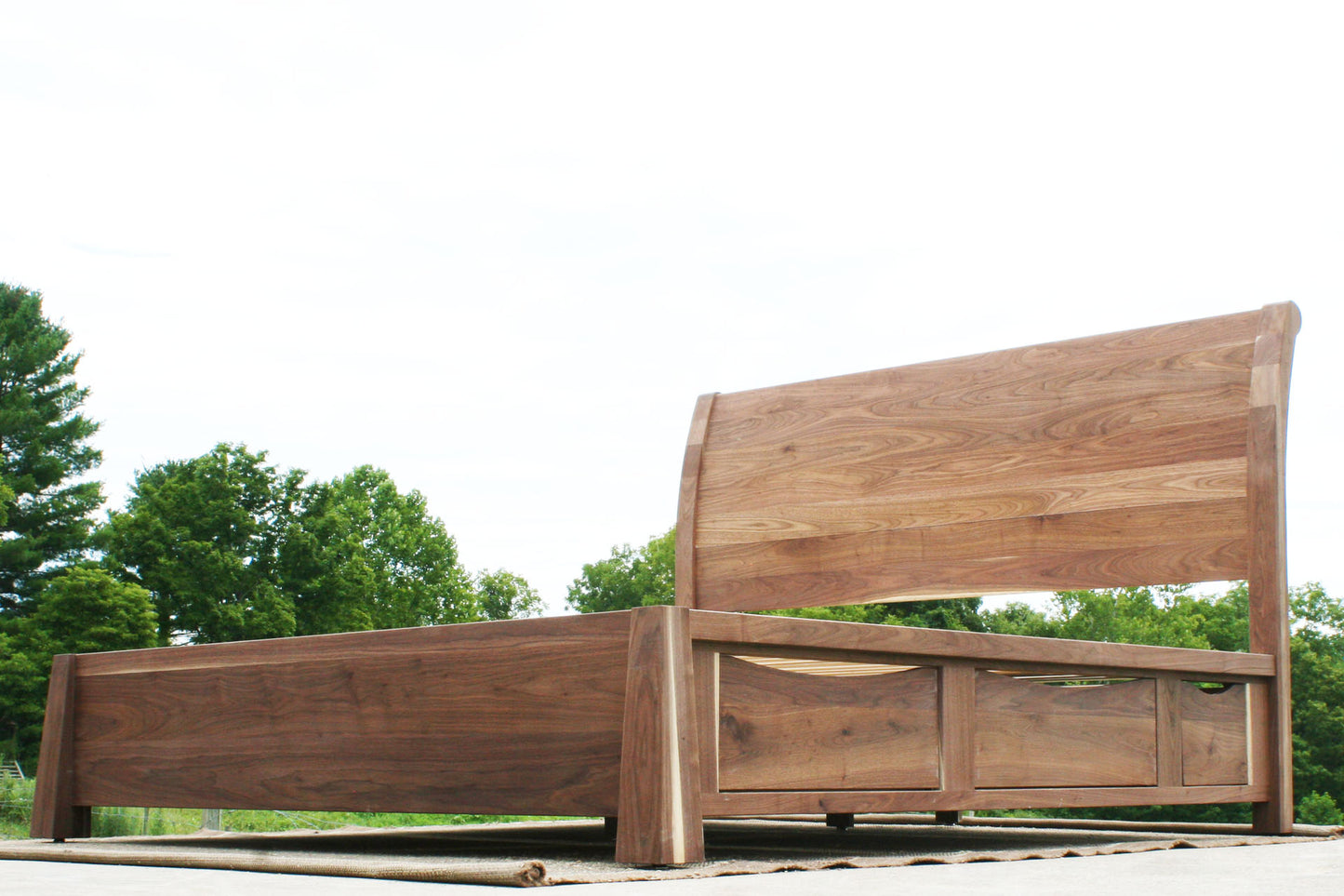 low angled view Sleigh Platform bed with 4 drawers and large posts