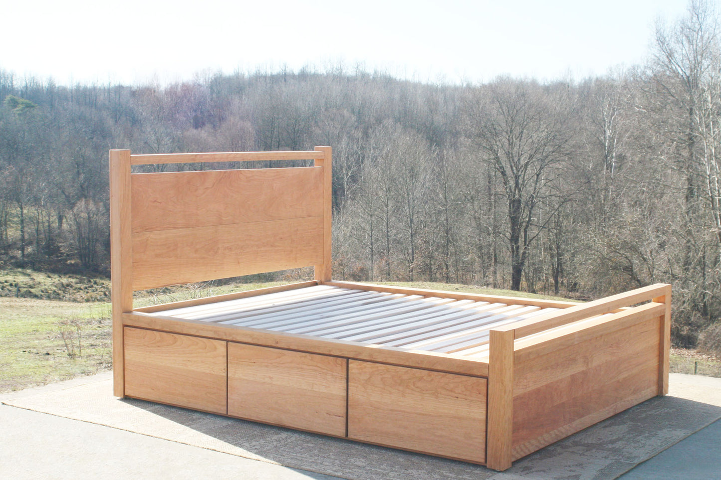 side angled view Storage Bed with top-rail head and footboard