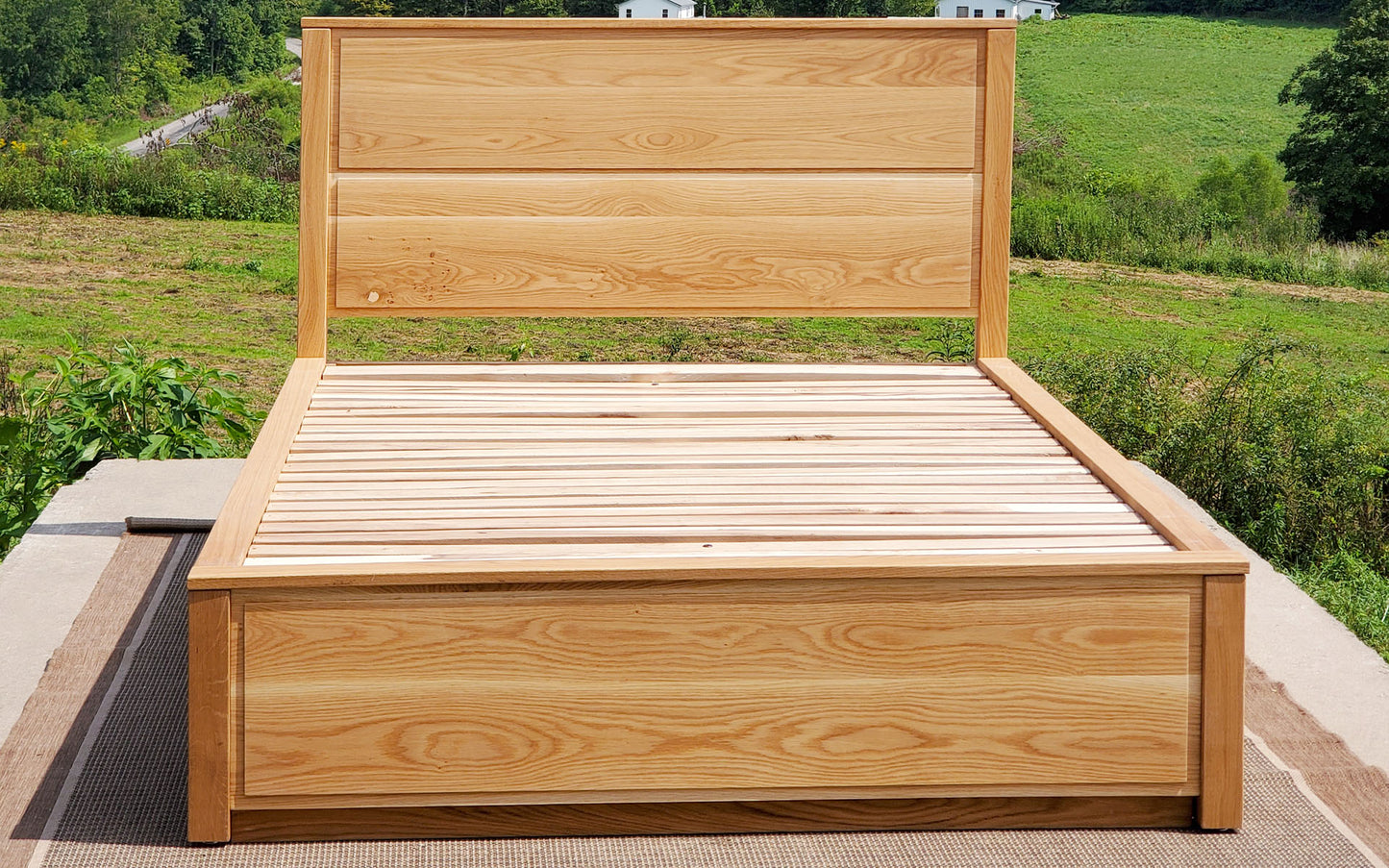 front view Storage Bed with 4 drawers, recessed frame headboard and toe kick