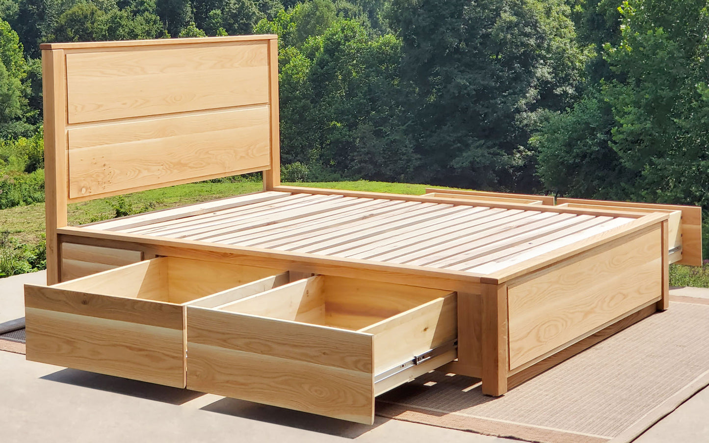 drawers open angled view Storage Bed with 4 drawers, recessed frame headboard and toe kick