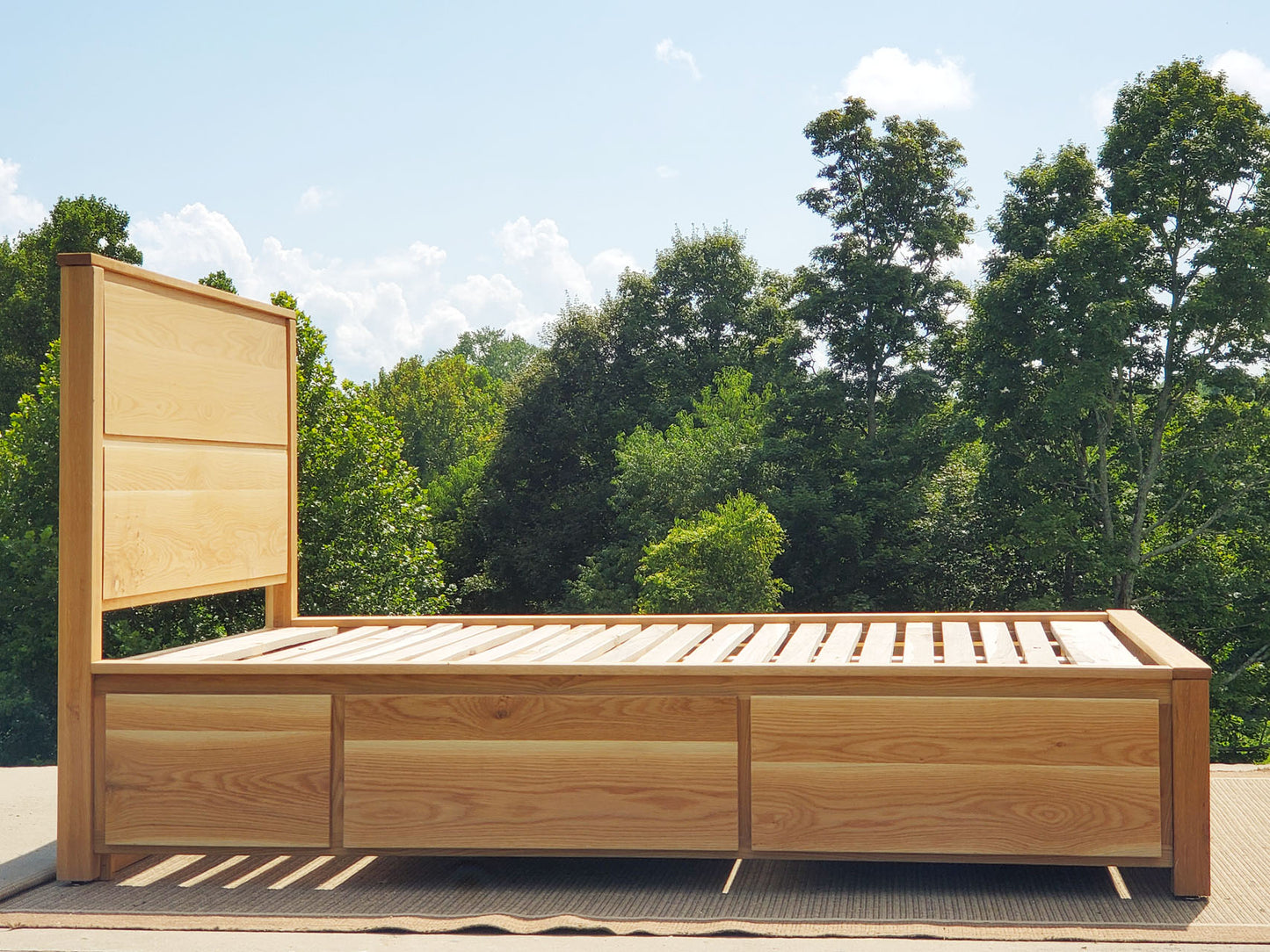 side view Storage Bed with 4 drawers, recessed frame headboard and toe kick