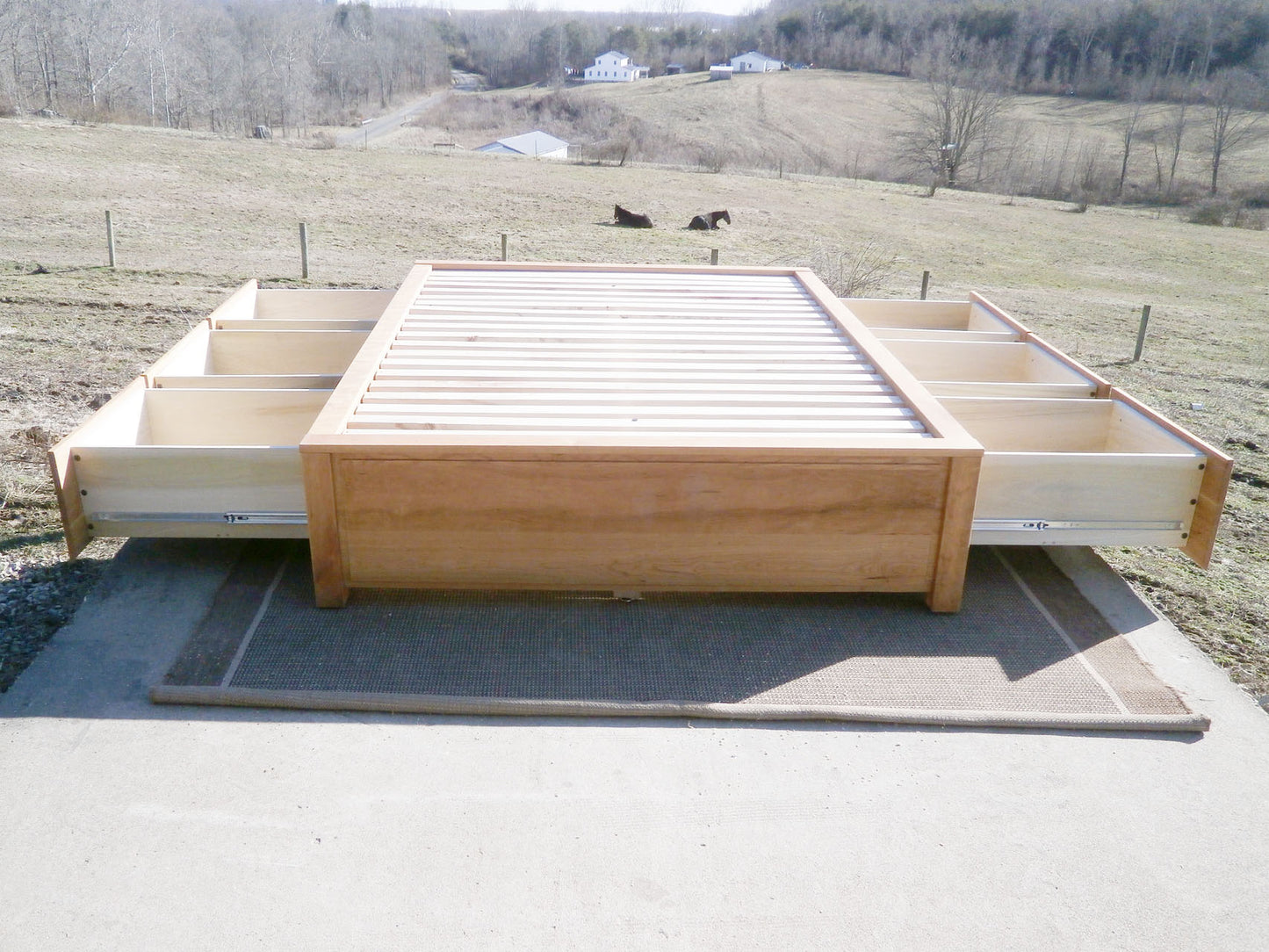 front view natural Platform Bed with 6 drawers and recessed frame drawers out