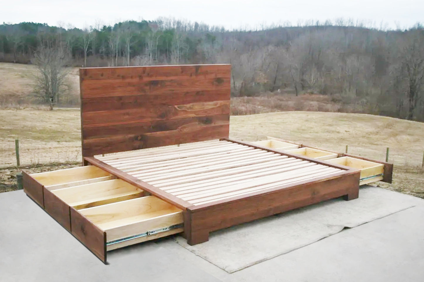 Low Storage Bed with 6 drawers open and thick headboard