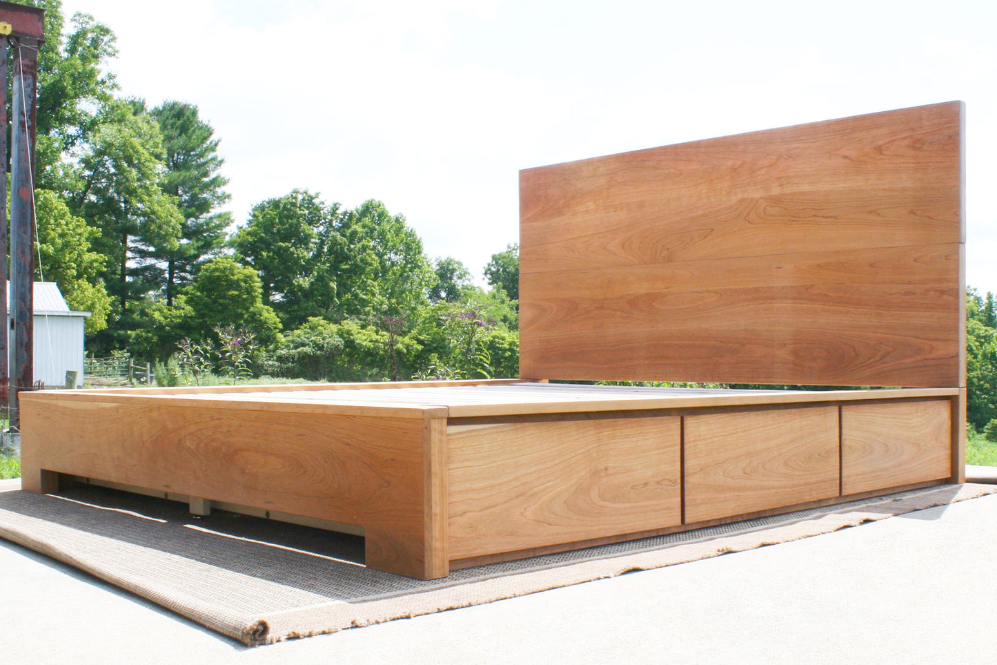 low angled view Low Storage Bed with 6 drawers and thick headboard