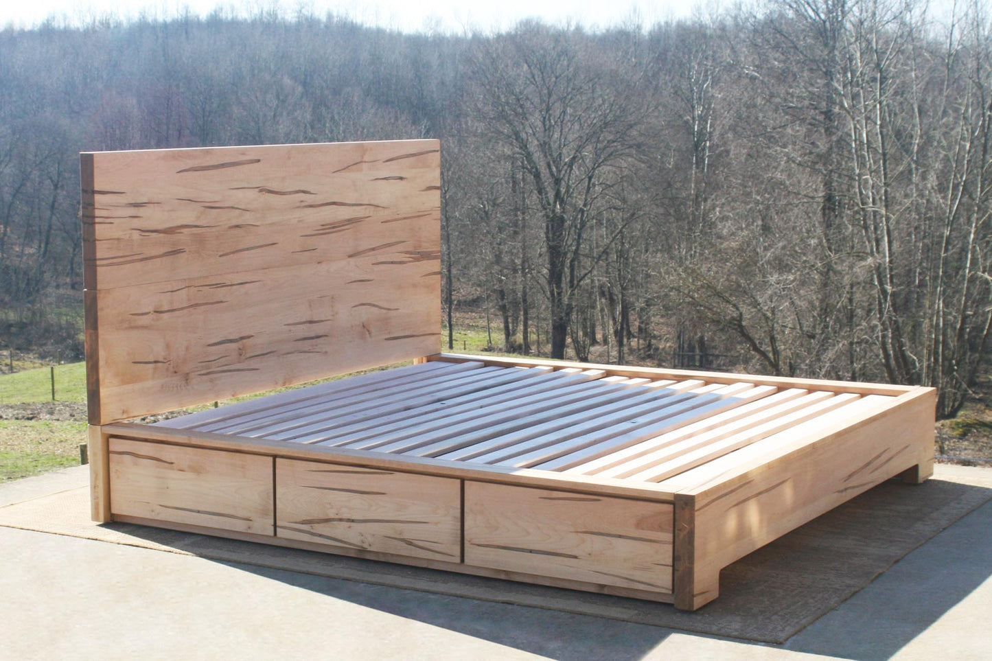 Low Storage Bed with 6 drawers and thick headboard angled view