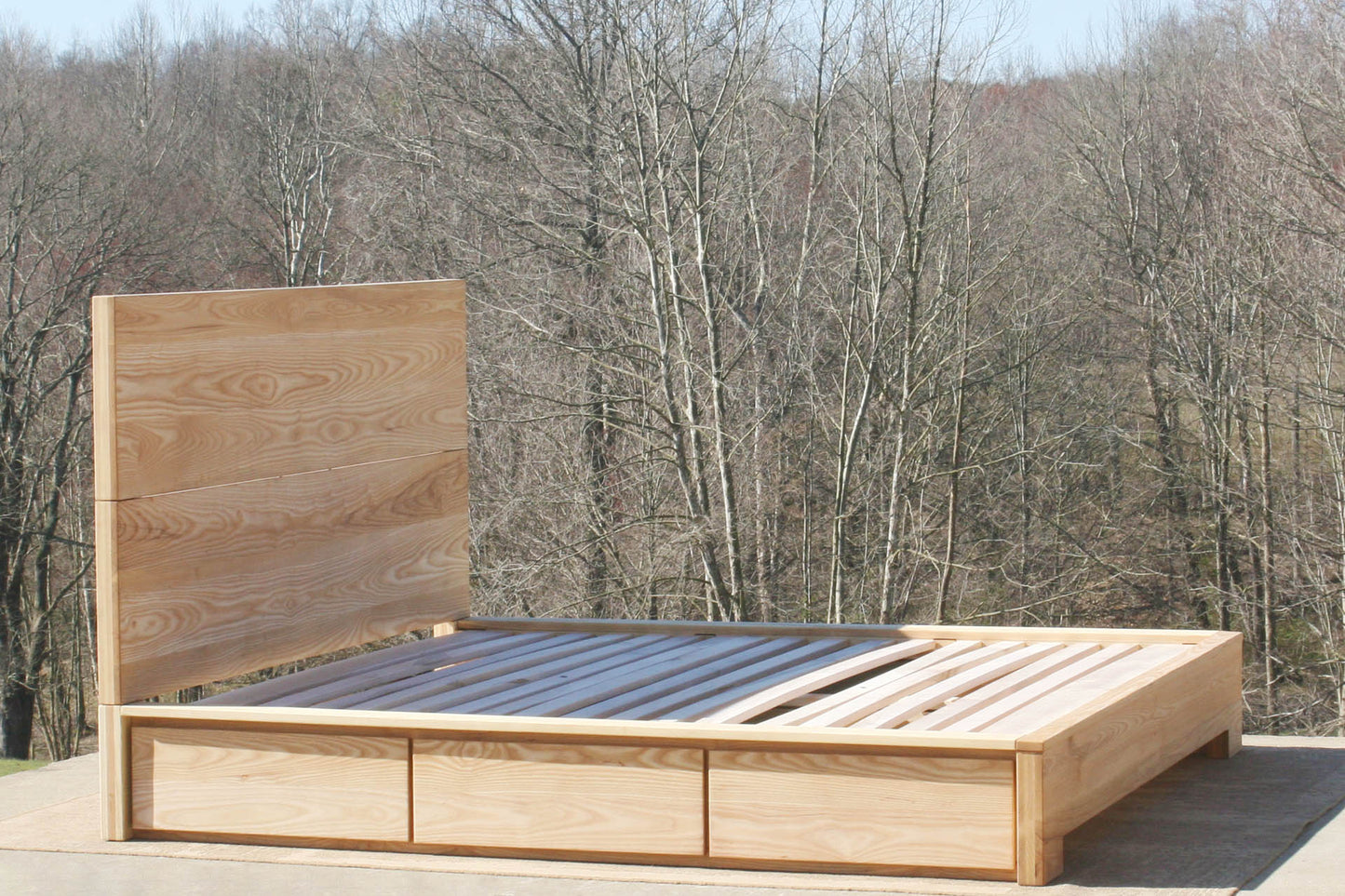 angled view natural wood Low Storage Bed with Beveled Overlays