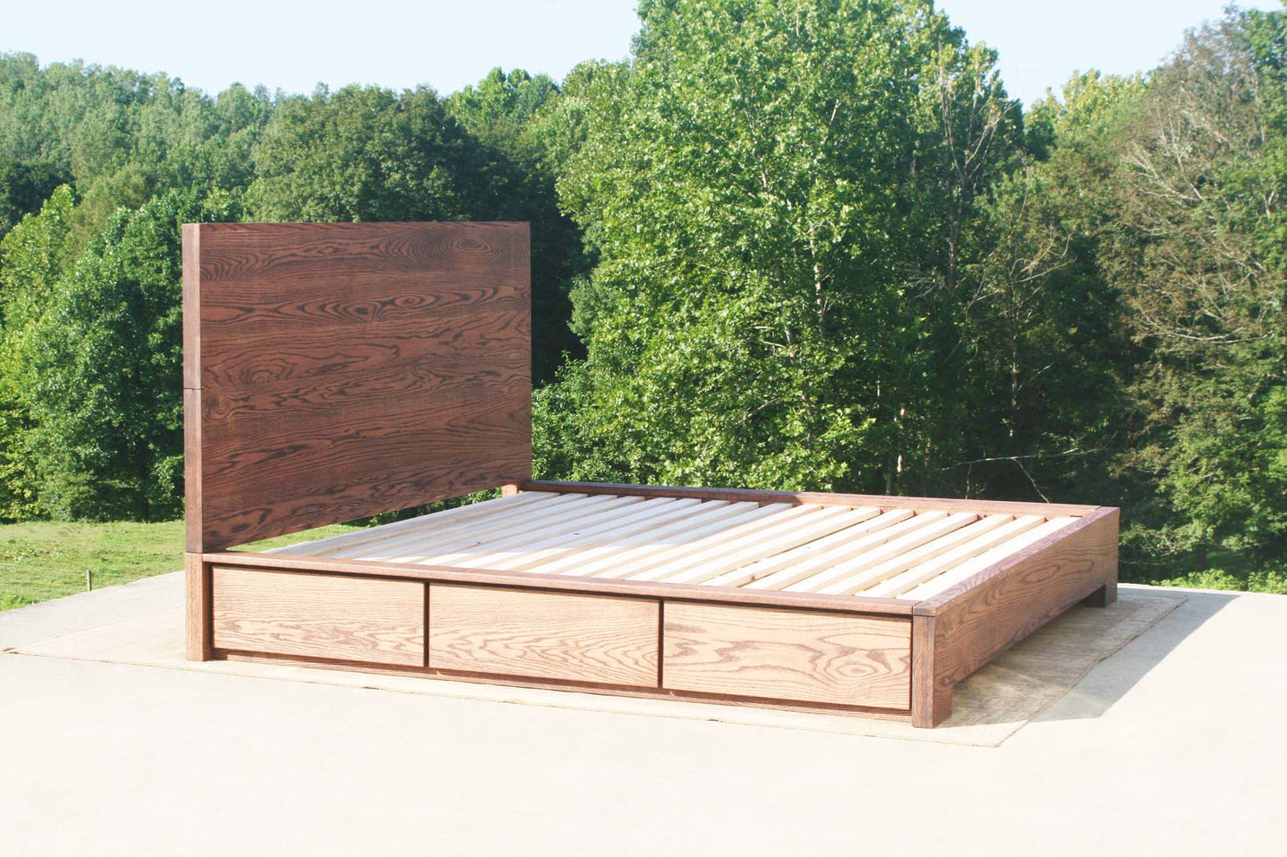 angled view solid Low Storage Bed with 6 drawers and thick headboard