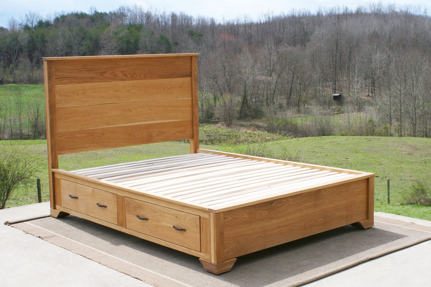 angled view Storage Bed with 4 inset drawers and headboard