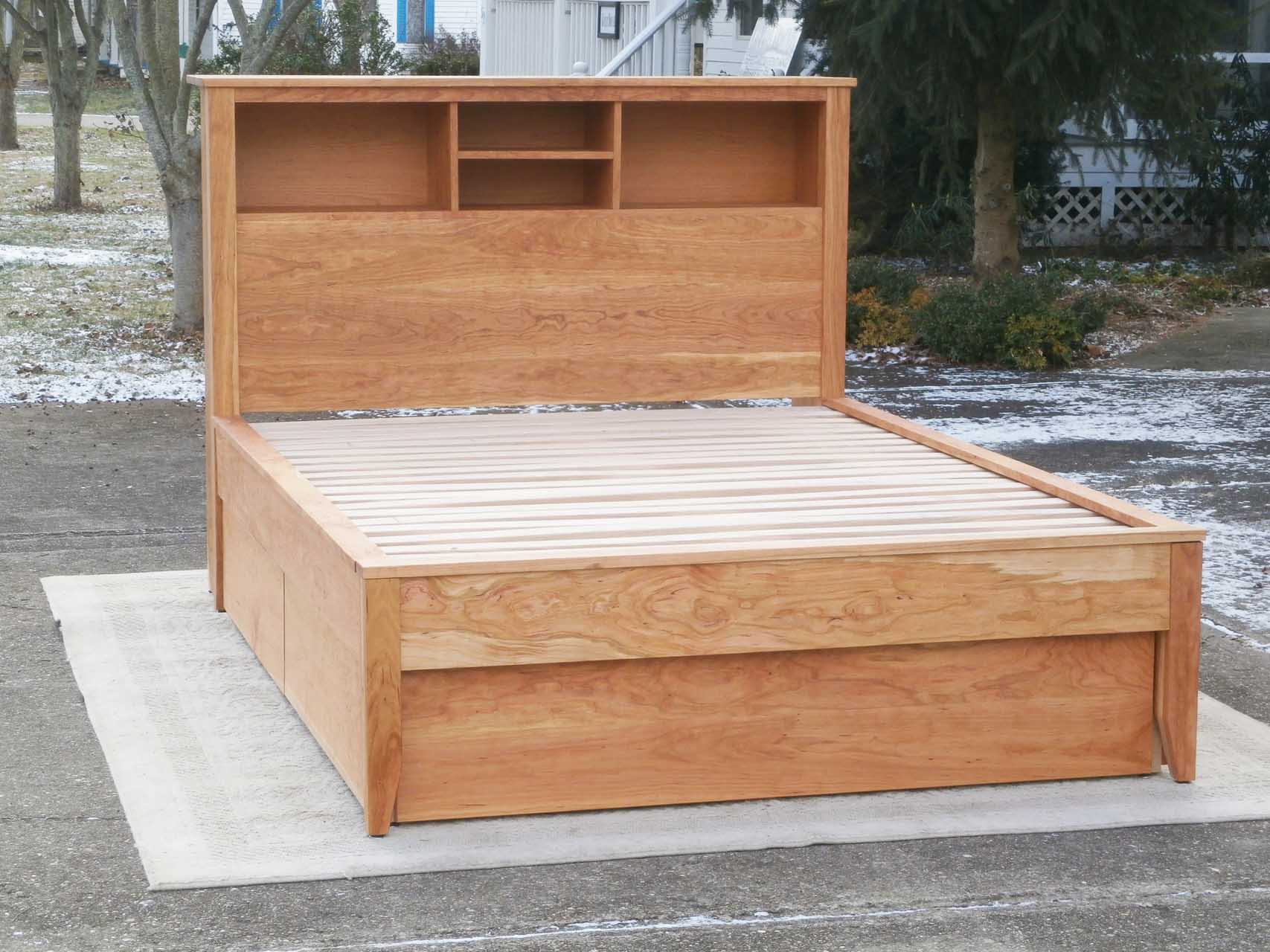 front view platform bed with bookcase headboard and 4 drawers